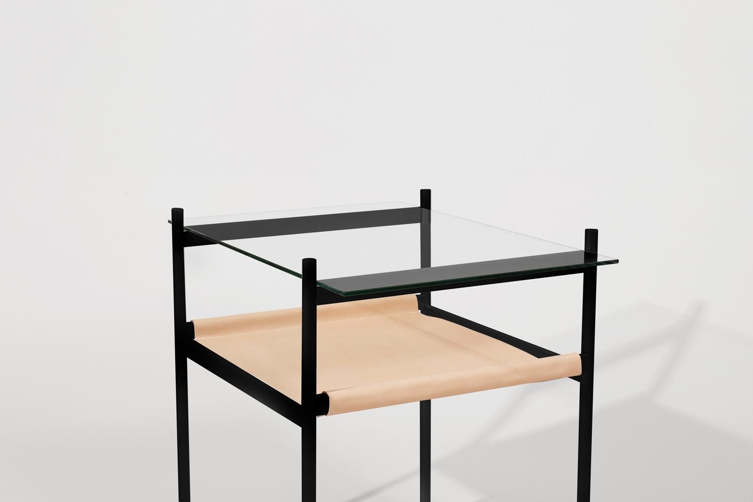 Made to order. Please allow six weeks for production.

Black frame / clear glass / natural leather sling

The Duotone Furniture series is based on a modular hardware system that pairs sturdy construction with visual lightness and a range of