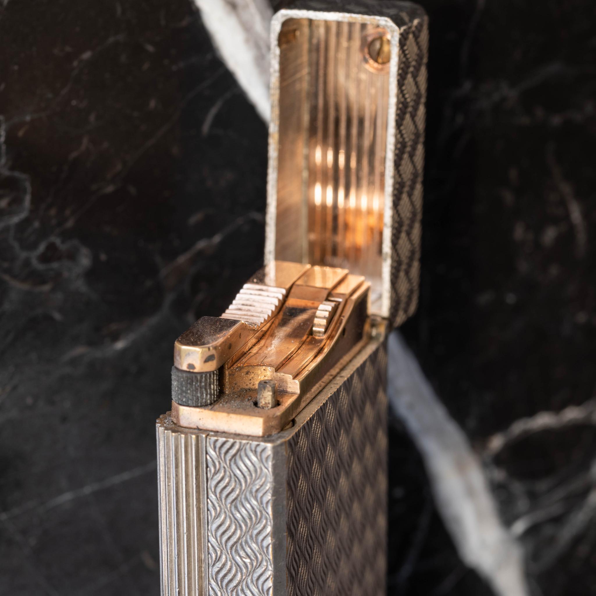 Rare 1960's Dupont Hermès special edition silver plated Ligne 1 gas lighter with engraved ‘wave' decoration.

Each Dupont has a serial number unique to that particular lighter. This example is marked on the base, ’S.T Dupont - Hermès - Paris' - with