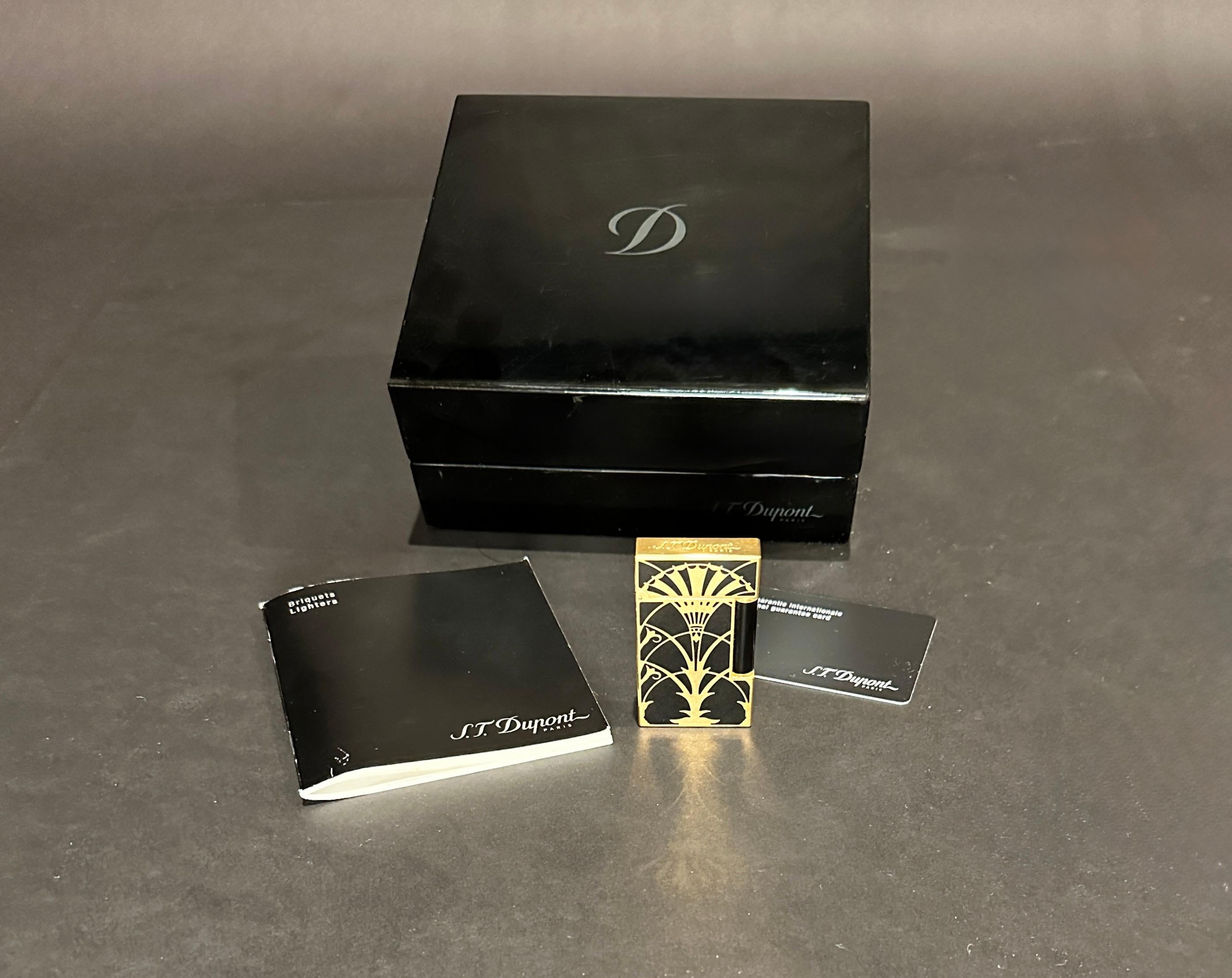 This is a limited edition S.T Dupont Ligne 2 Lacquer American Art Deco (Chrysler Building) Lighter. Since the beginning of the 20th Century, Art Deco has influenced many areas of designs, architecture, fashion, jewelry, painting, graphics, and film.