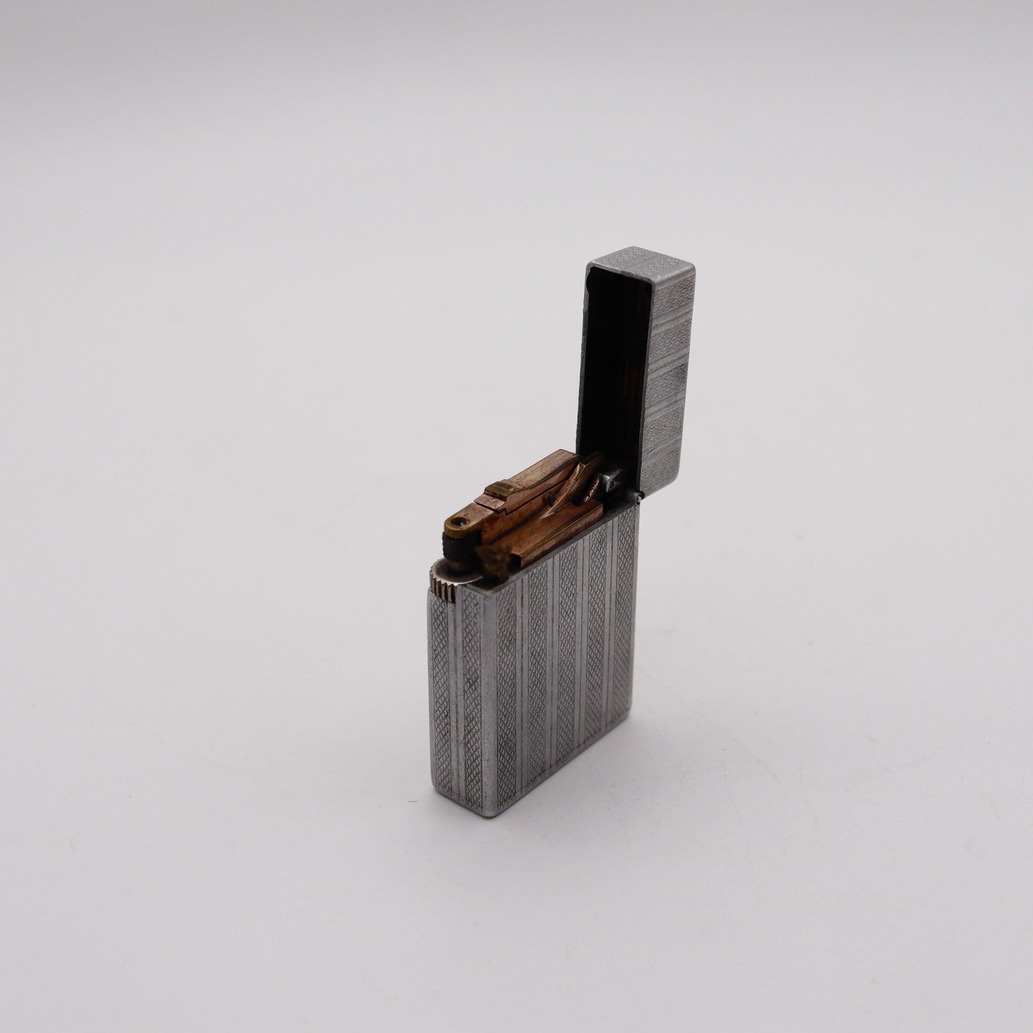 A Dupont petrol lighter made in France.

This is a very nice pocket petrol lighter created in Paris France during the post war period, back in the 1940's. The lighter has been produced by the S.T. Dupont company in solid aluminum and bronze parts