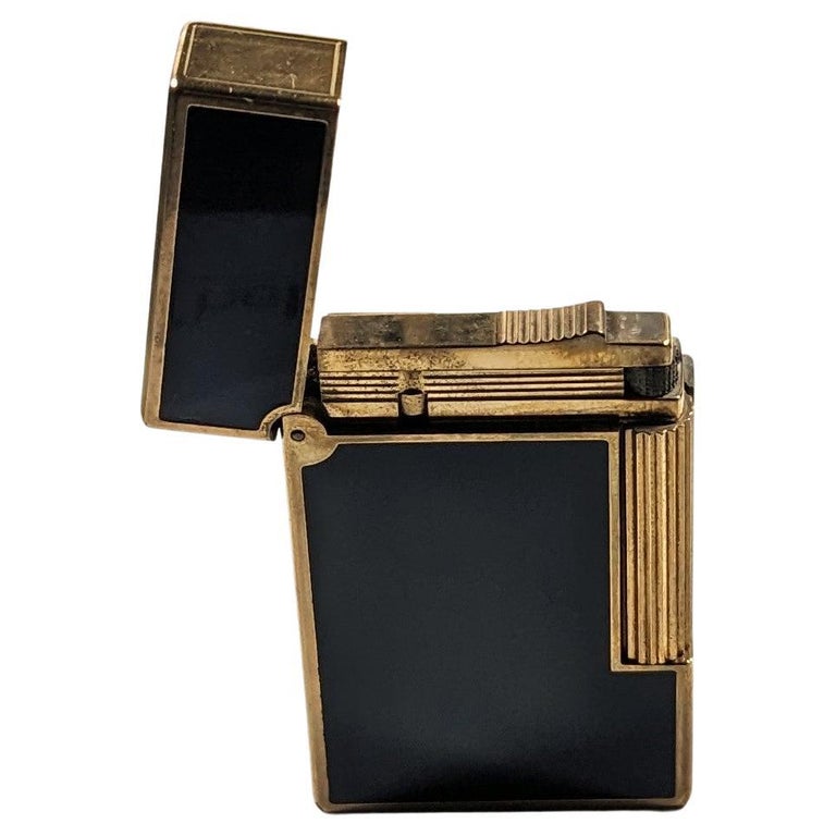Sold at Auction: 2 Vintage Cartier Lighters w/ 18K Gold Trim