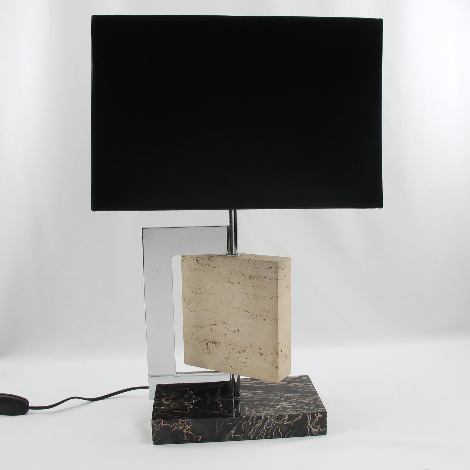 Stunning French Art Deco table lamp, reminiscent of Paul Dupre Lafon work. This elegant desk or table lamp features large Portor marble base plinth with travertine and chromed bronze body. Versatile geometric shape that allows to change the design