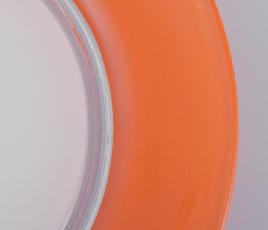 French Duralex, France. Set of four art glass plates in orange and white glass. 1970s For Sale