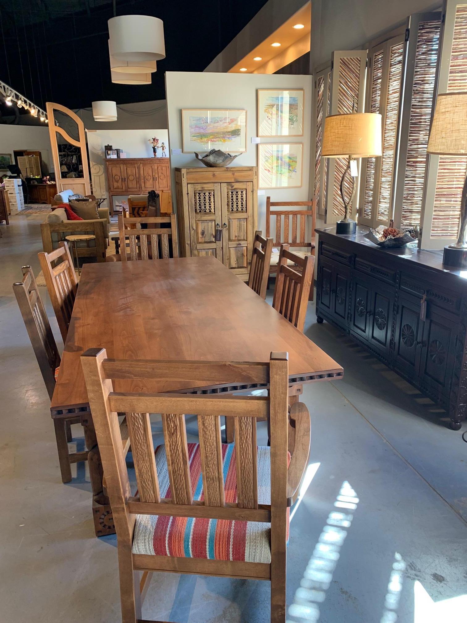 Beautiful Durango Captain Dining Chairs. Make in fruitwood with chip carving.
Matching side chairs available and for sale in our storefront.

These are showroom floor models and do show some wear.