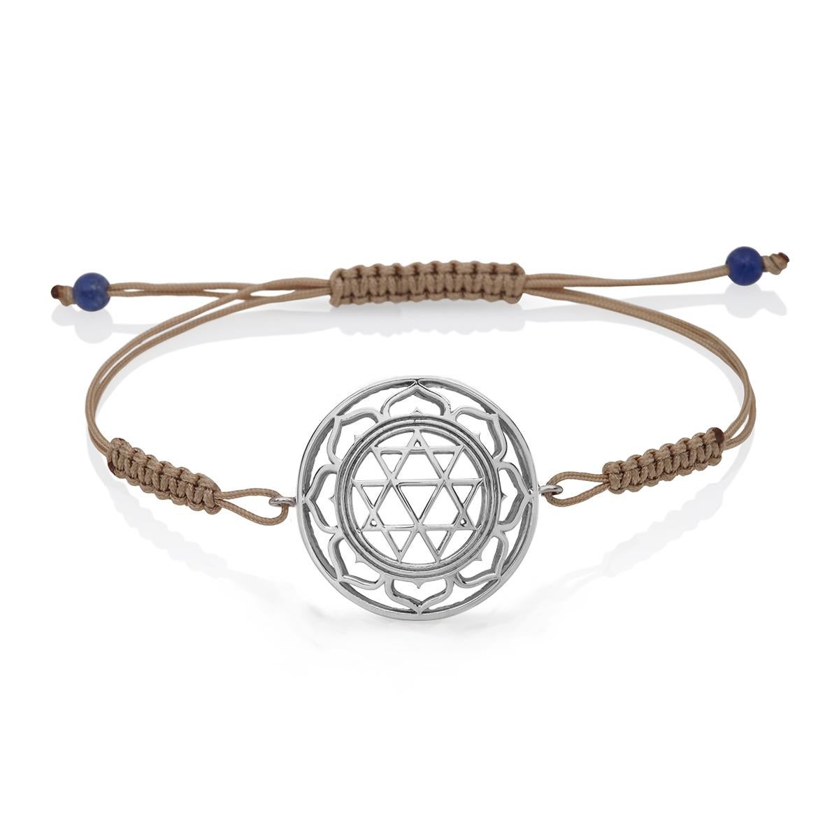 Durga Macrame Bracelet in 14Kt white Gold with Brown Cord  and Lapis Lazuli Beads.
A very beautiful and wearable macrame bracelet made of 14Kt Gold. It will match with everything in your closet. Designed by Nicofilimon – a jewelry brand renowned for