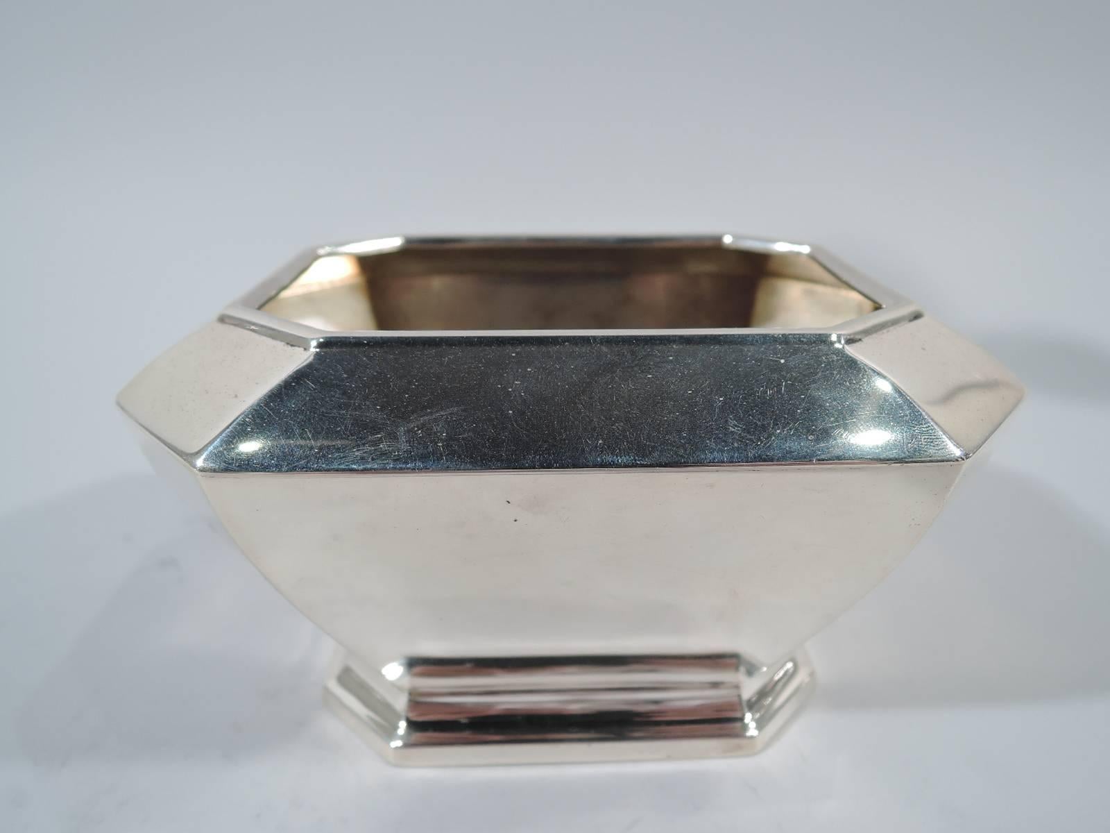 Art Deco sterling silver bowl in Fairfax pattern. Made by Durgin (a division of Gorham) in Concord, New Hampshire. Four tapering sides with chamfered corners. Inset mouth and raised foot same. Hallmark includes no. 04. Weight: 7.3 troy ounces.