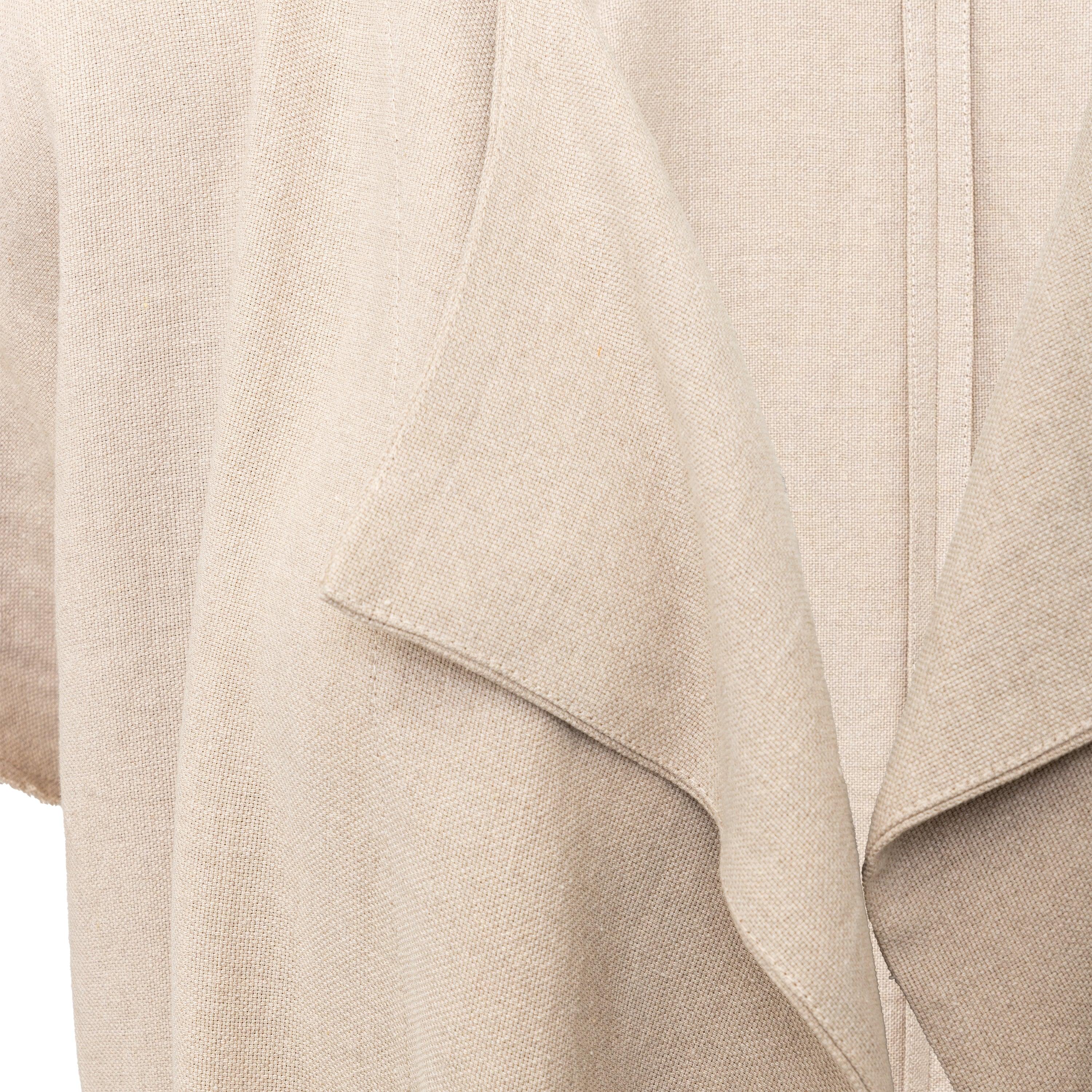 Expertly crafted, the Dušan Linen Half Sleeve Jacket is made of soft, light beige linen. With an open front and side slits, this jacket boasts a raw hem edge and longer front for a modern, effortless look.

Sleeve (From