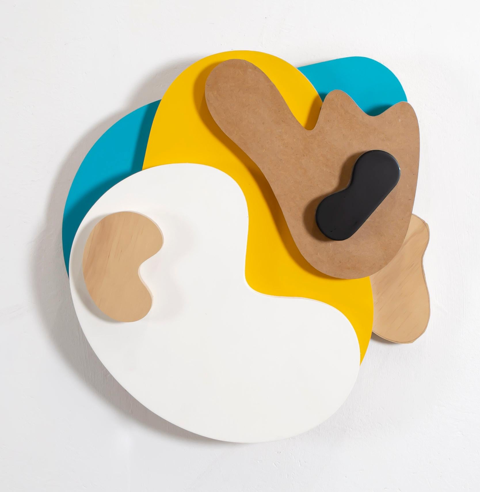 «A happy little accident» wall relief comprised of coloured, odd rounded shapes 