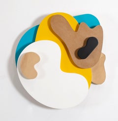 «A happy little accident» wall relief comprised of coloured, odd rounded shapes 