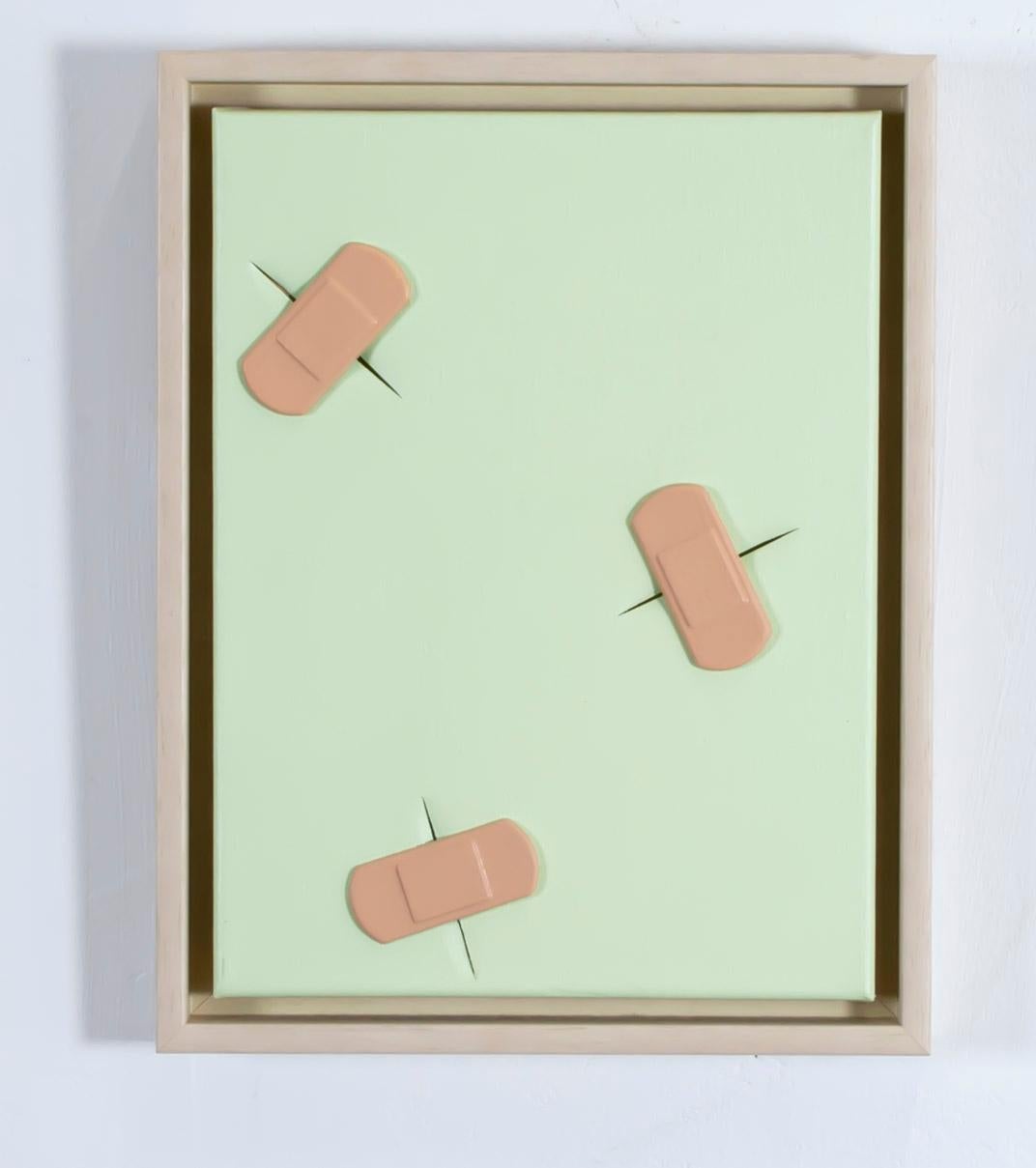 «Boo-boos (by Lucio)» teal green cut canvas covered with cast plastic band-aids - Mixed Media Art by Dustin Cook
