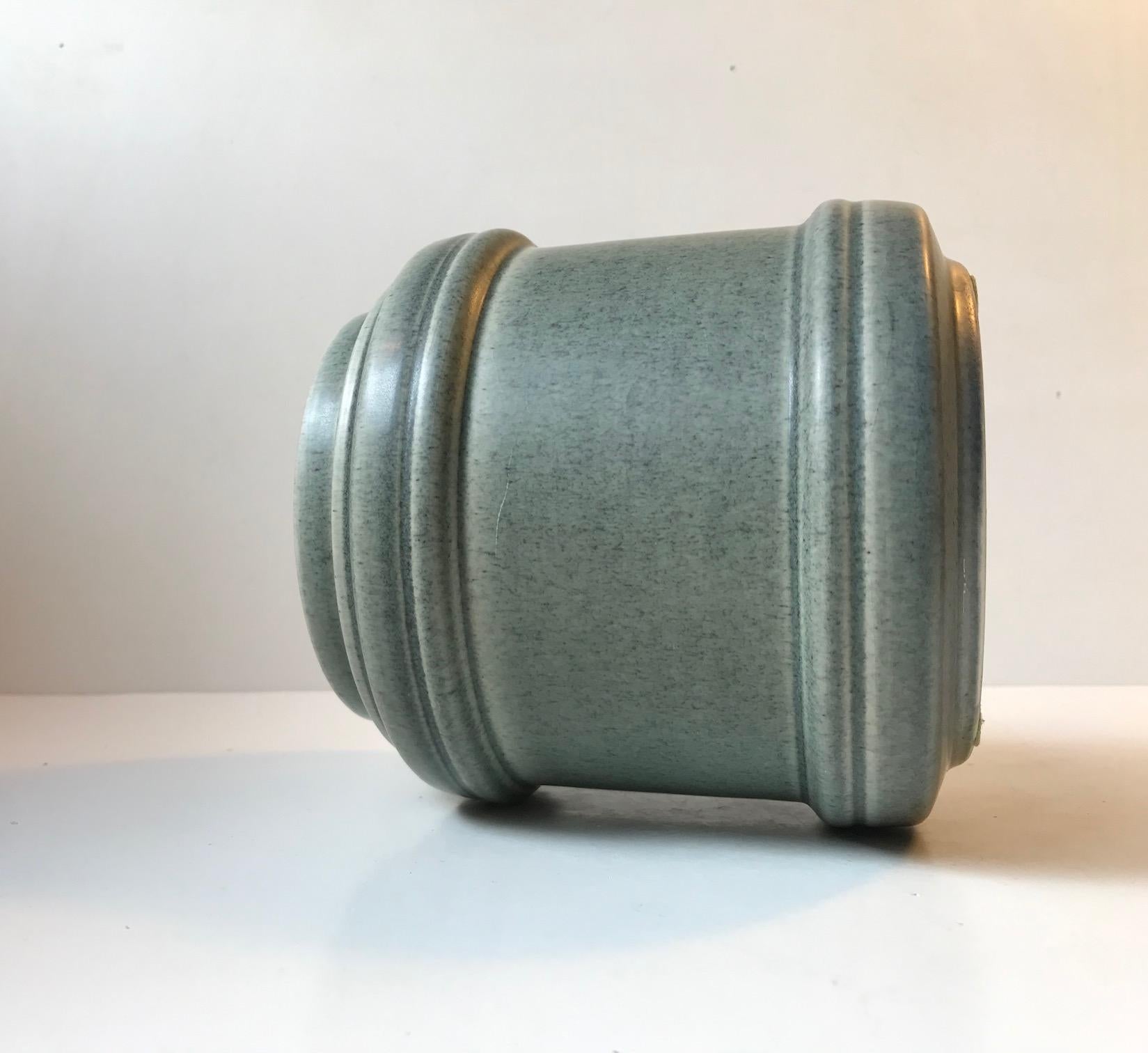 Berndt Friberg inspired ceramic vase with architectural features and soft dusty blue glaze. Designed by Danish Ceramist Einar Johansen during the 1960s before he started as chief designer at Søholm Keramik. It is signed EJO to the base. This color
