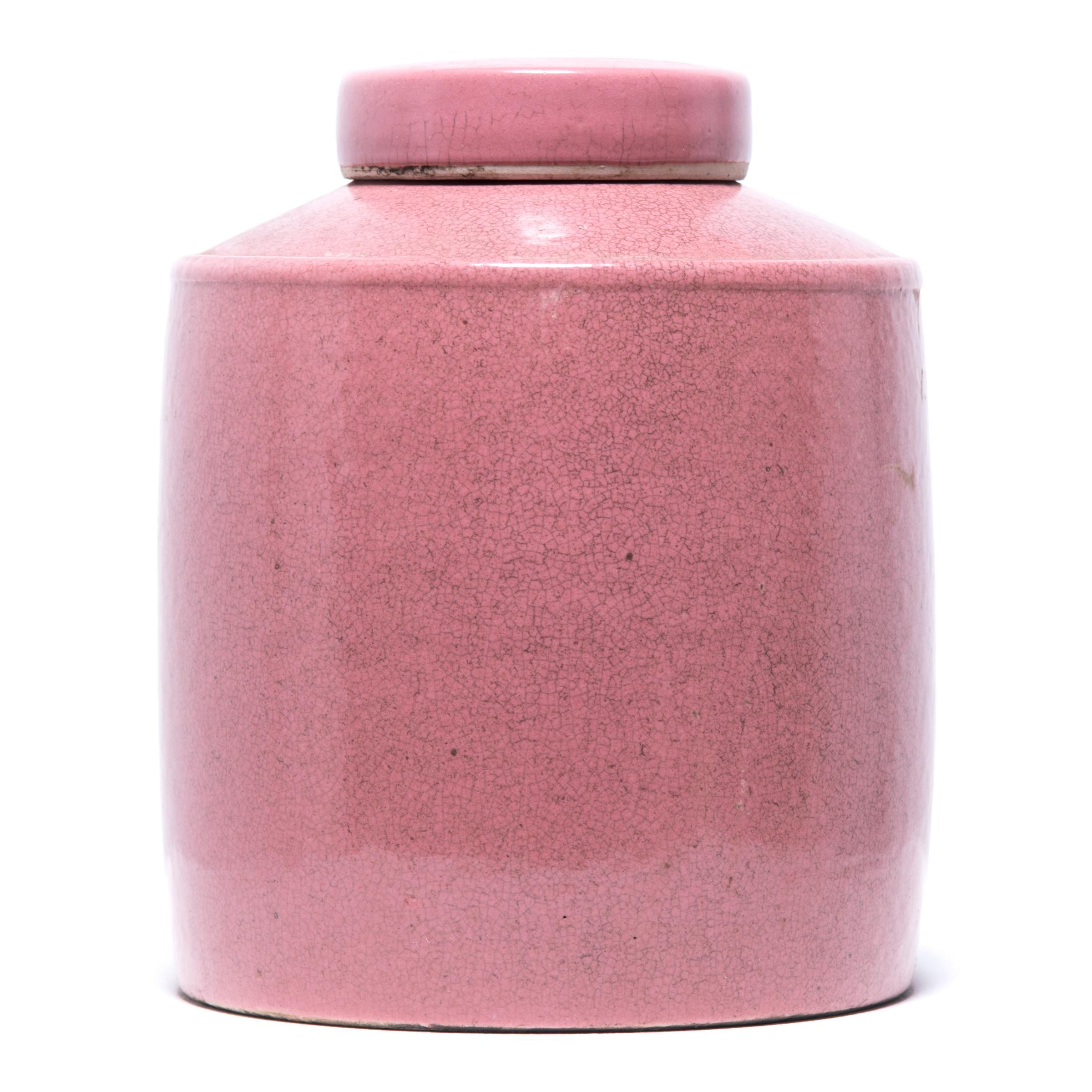 For centuries, Chinese ceramicists have redesigned and reinterpreted the same beautiful, ancient forms. Rendered in a striking shade of rose pink, this Classic jar takes on a modern look. Lidded jars like these were used in tea shops in China, where