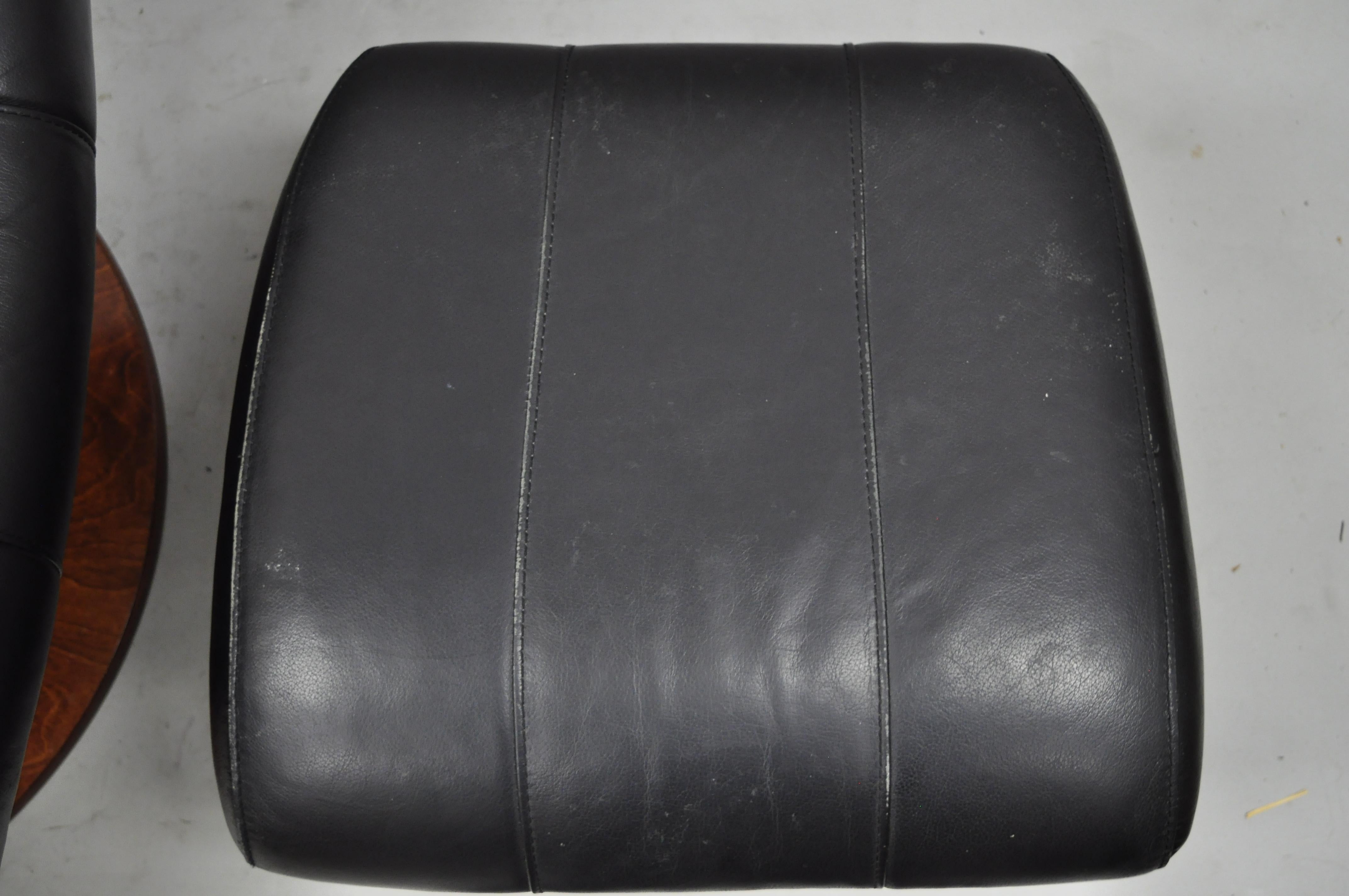 Dutailier Black Leather Avant Glide Glider Swivel Recliner Chair and Ottoman In Good Condition In Philadelphia, PA