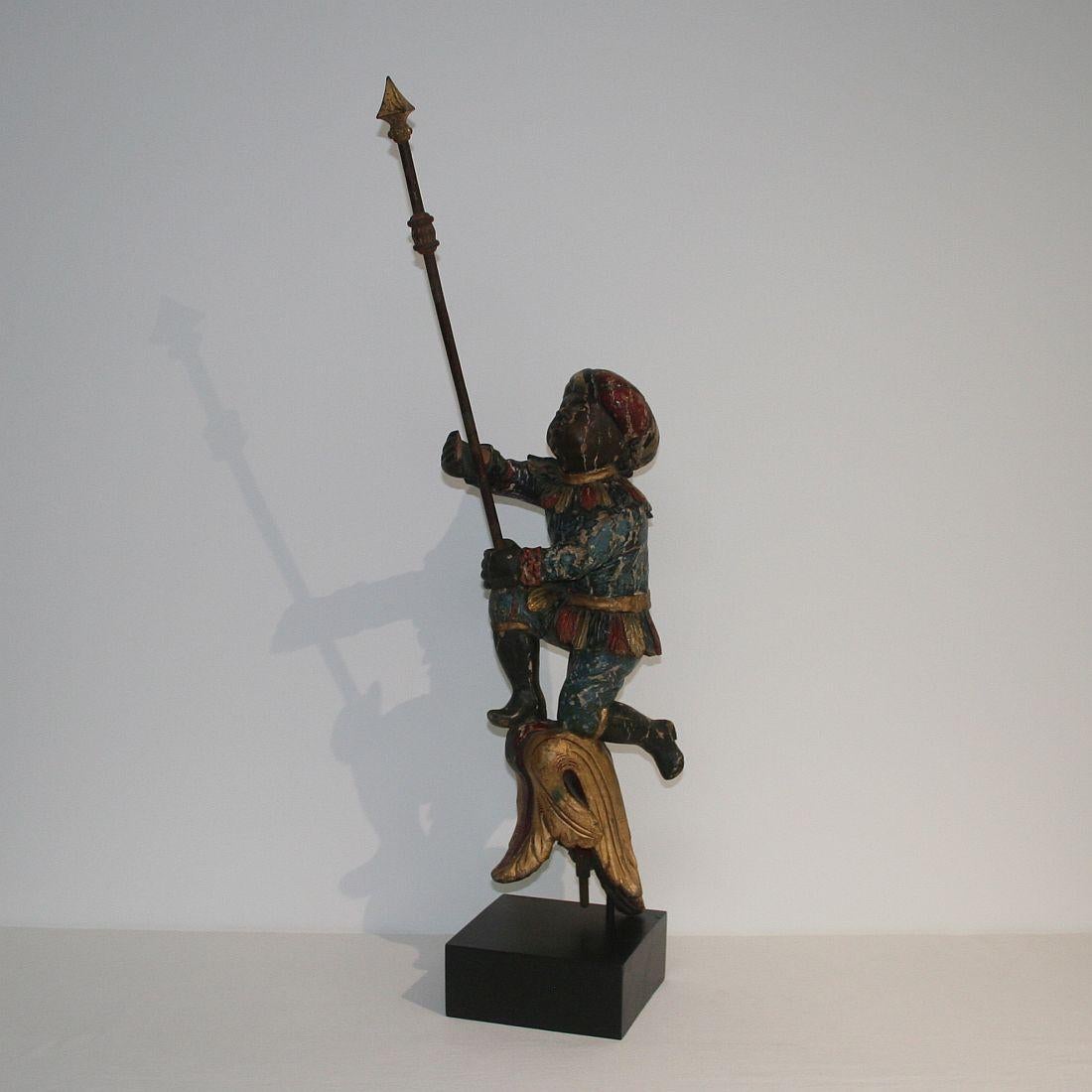 Beautiful and very rare 18th century standard bearer, Holland, circa 1750-1800. Weathered, small losses and old repairs. Measurement includes the base.










 