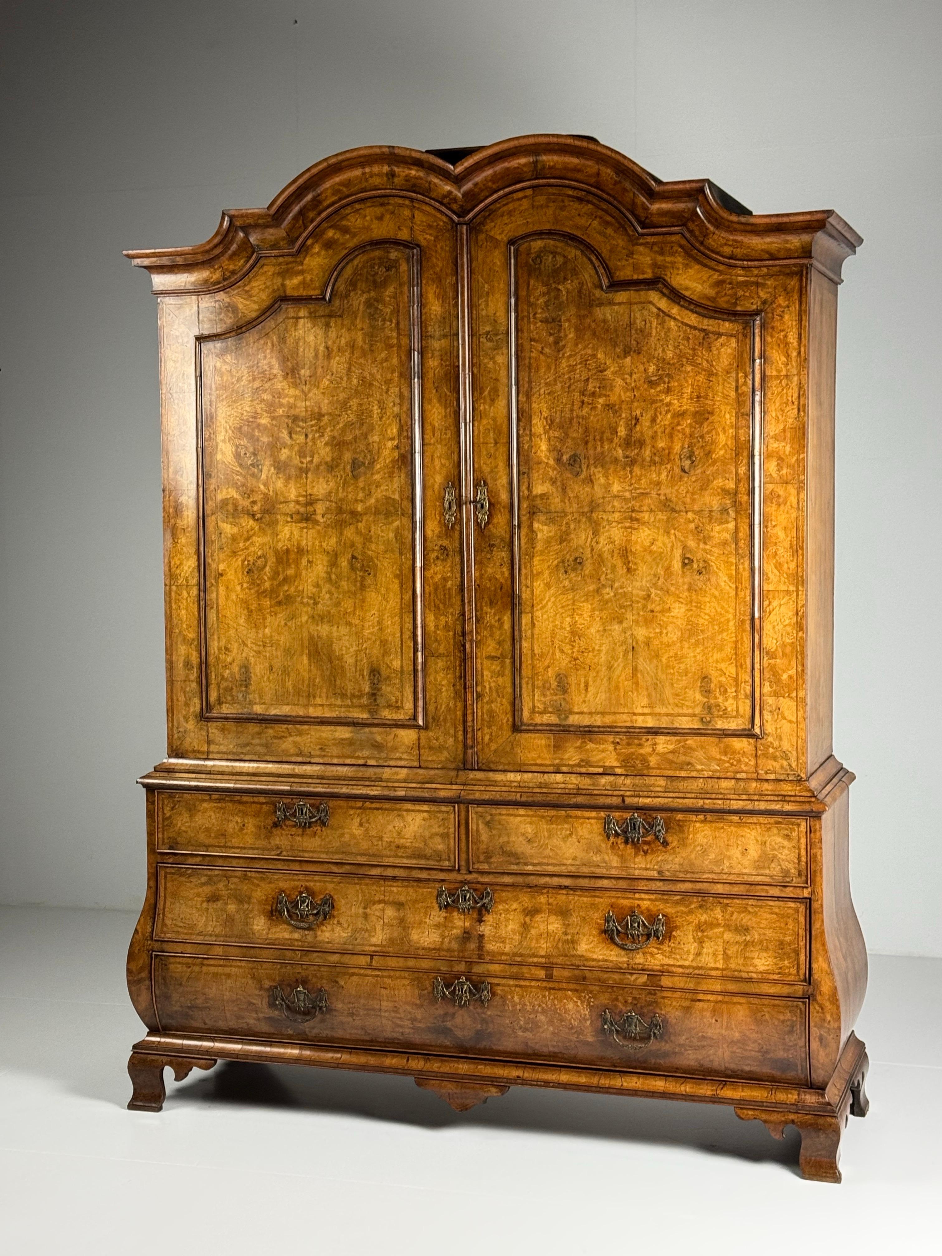 Dutch burr walnut cabinet, 18th century.

A particularly beautiful and original cabinet. Originating from the Netherlands, made around 1770-1790. Crafted from solid oak and entirely veneered in burr walnut.
Curved base cabinet. Doors close properly.