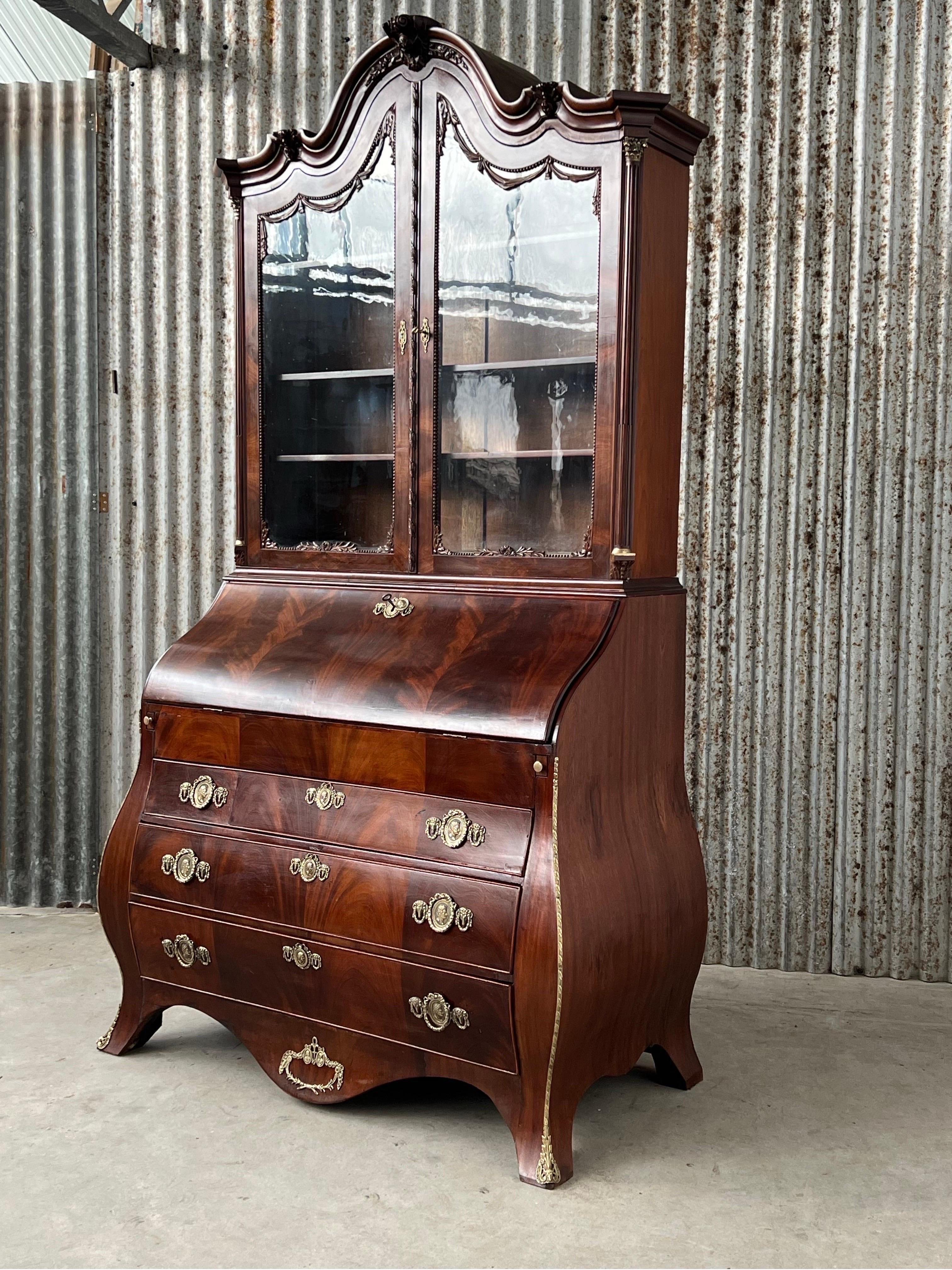 Polished Dutch 18th century Cuban mahogany bombé writing cabinet with glass upstand.  For Sale