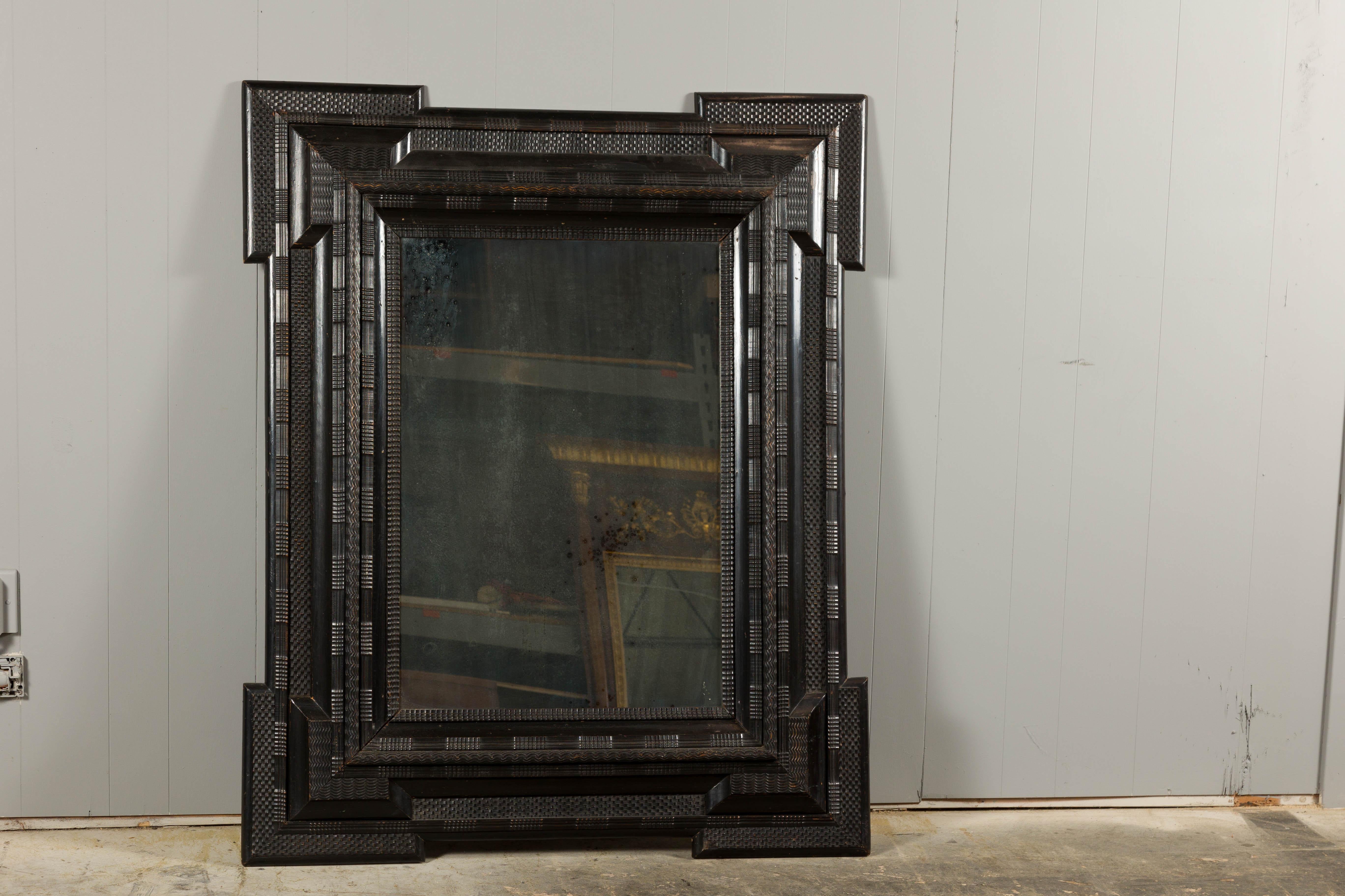 Dutch 18th Century Dark Brown Carved Wooden Mirror with Protruding Corners In Good Condition For Sale In Atlanta, GA
