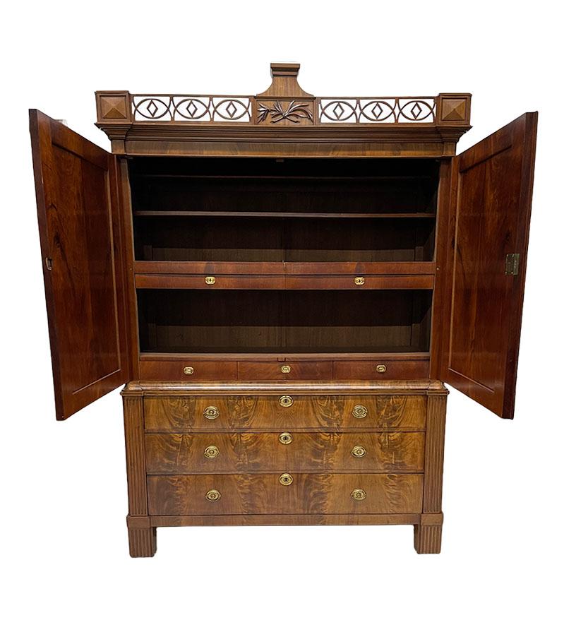 Dutch 18th Century mahogany cabinet

A Louis XVI mahogany cabinet with straight hood with railings. An oak with mahogany veneer cabinet. In the front two doors, each with oval dot gadrooned panel. In the middle of the cabinet is left and right a