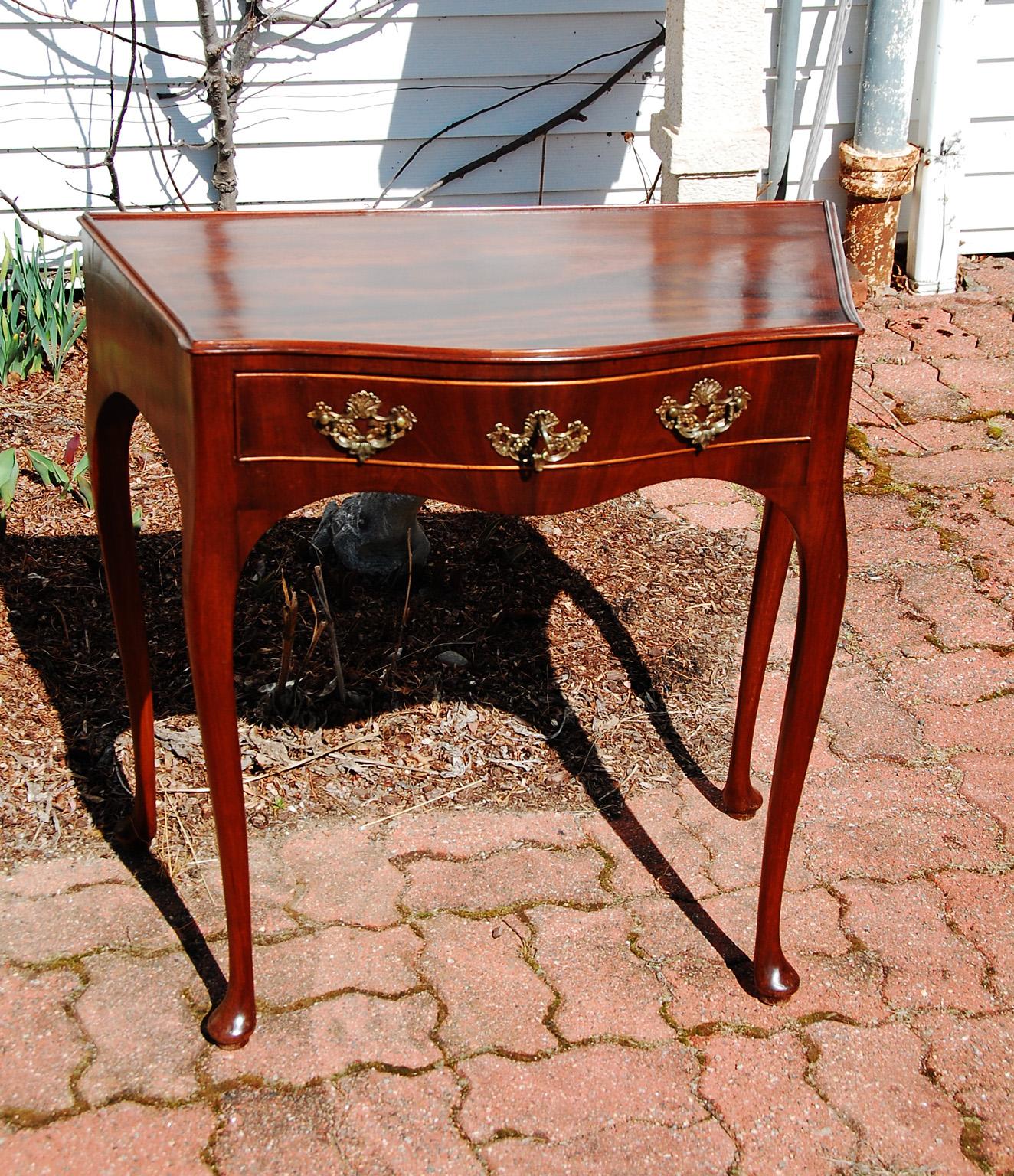 Dutch late 18th century serpentine mahogany side table with cabriole legs, pad feet and bead gallery. The single serpentine drawer and shaped skirt to sides as well as the front gives this elegant table gravitas. It is in wonderful proportions and