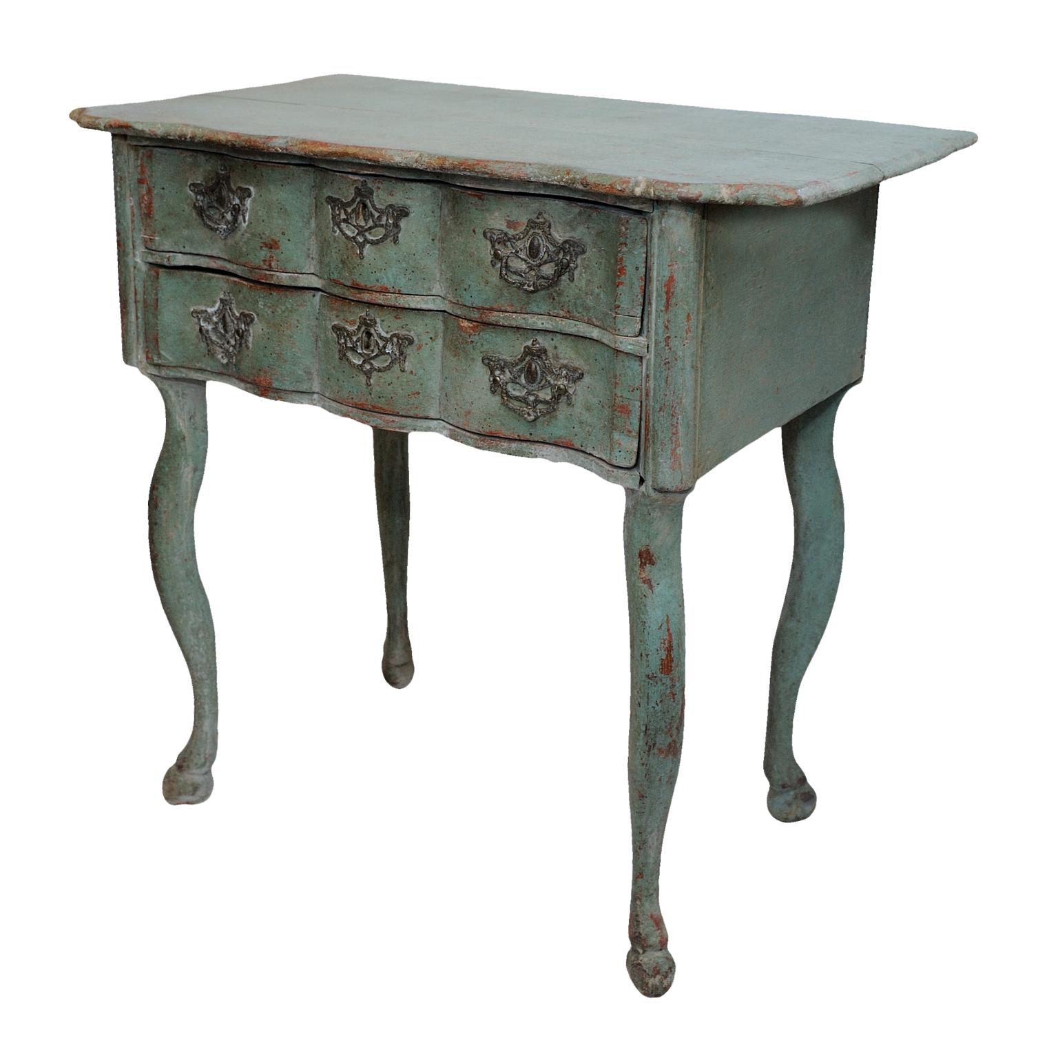 ?This is a small and rather elegant Dutch 18th century serpentine painted side table, with two drawers, standing on cabriole legs and retaining its original handles, circa 1760.
?Paintwork refreshed.
 