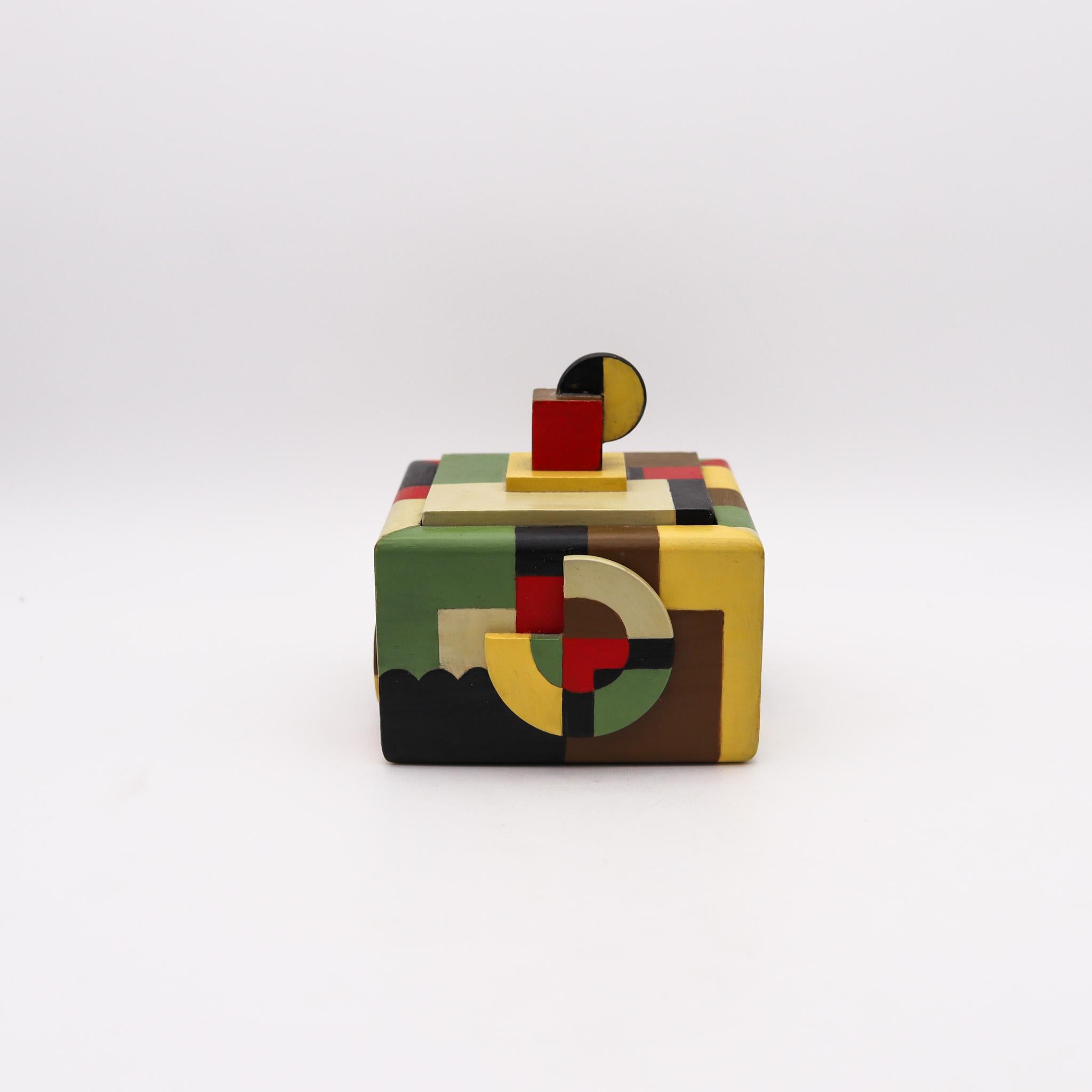 De Stijl trinket box in wood

Fabulous colorful trinket box, created in the northern region of Europe, probably in the Netherlands or Germany. It was crafted with the De Stijl artistic parameters in wood with polychromate paints of different