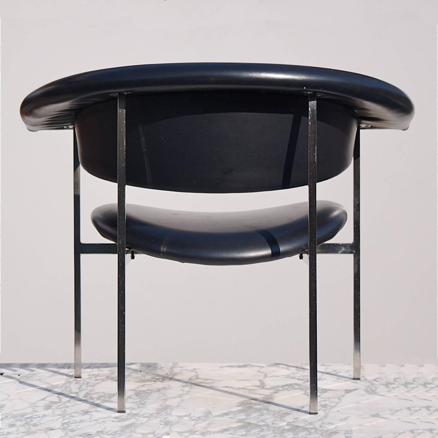 Comfortable, modernist, sci-fi, industrial armchair designed by Rudolf Wolf in 1962. Design name is Gamma. This chair has a faux leather, skai leather padded seat, demi circle, half circle, wrap around back and arm rest on a nickel-plated square