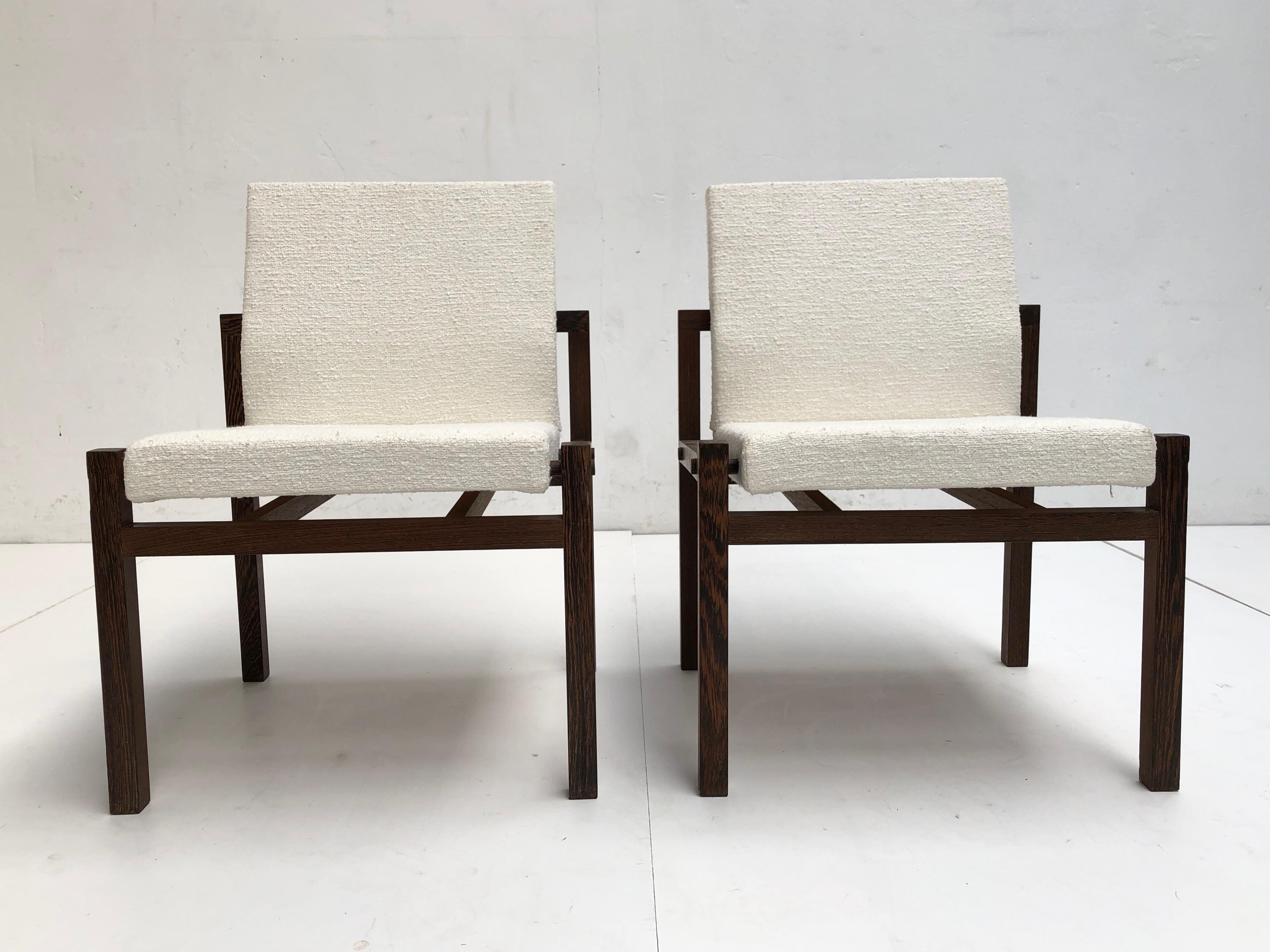 Very nice engineered and constructed pair of Dutch lounge chairs that are most likely a design by Martin Visser or Hein Stolle for 't Spectrum early 1960s.

The frames are made of solid Wenge wood and has dowel caps to hide the screws

We
