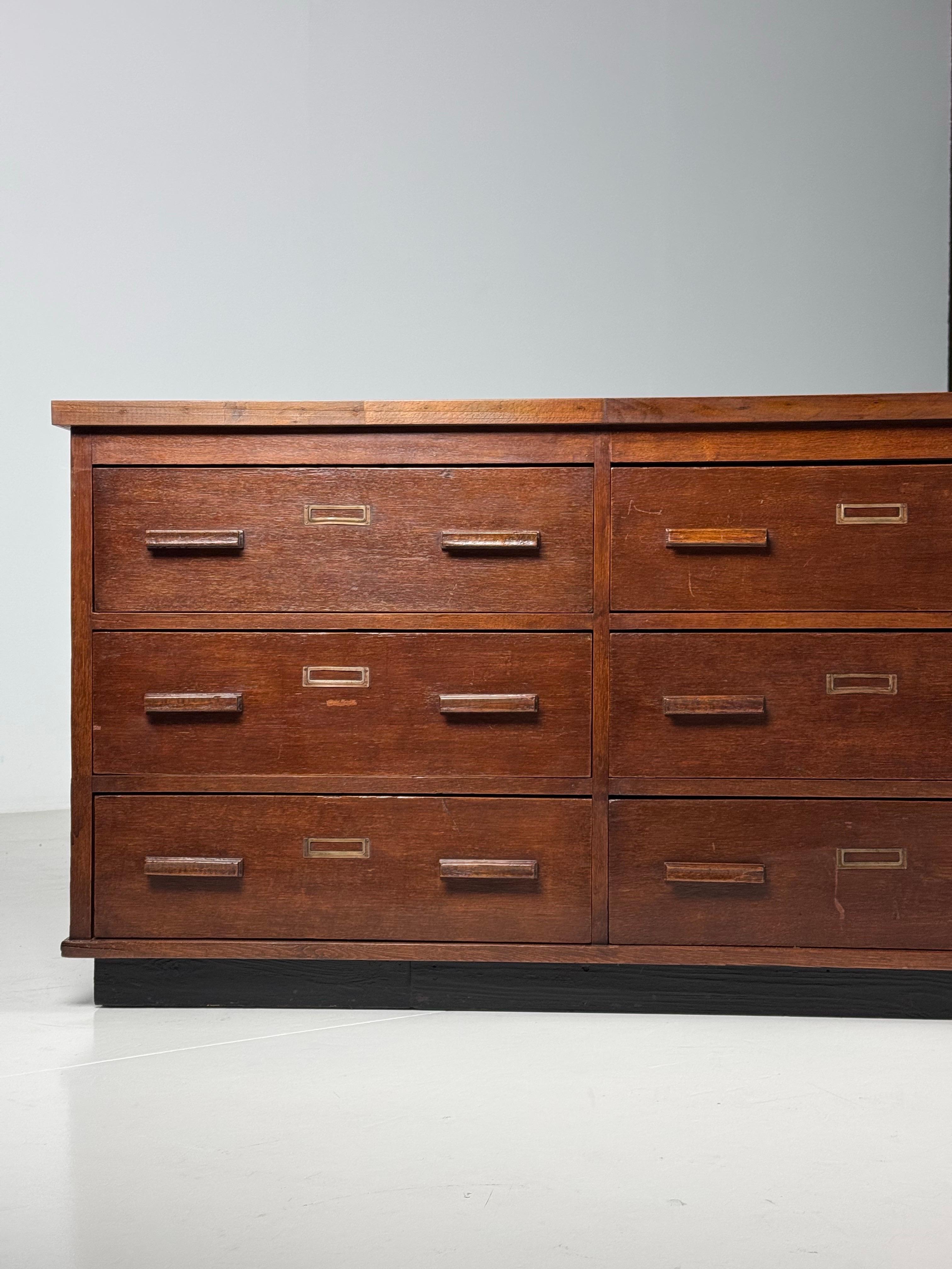 Vintage Sideboard / Apothecary cupboard / Chest of drawers / TV Furniture. Large size. Originates from the Netherlands, 1960s. In very good condition. With 12 smooth-running drawers.

Dimensions: 262L x 56D x 75H