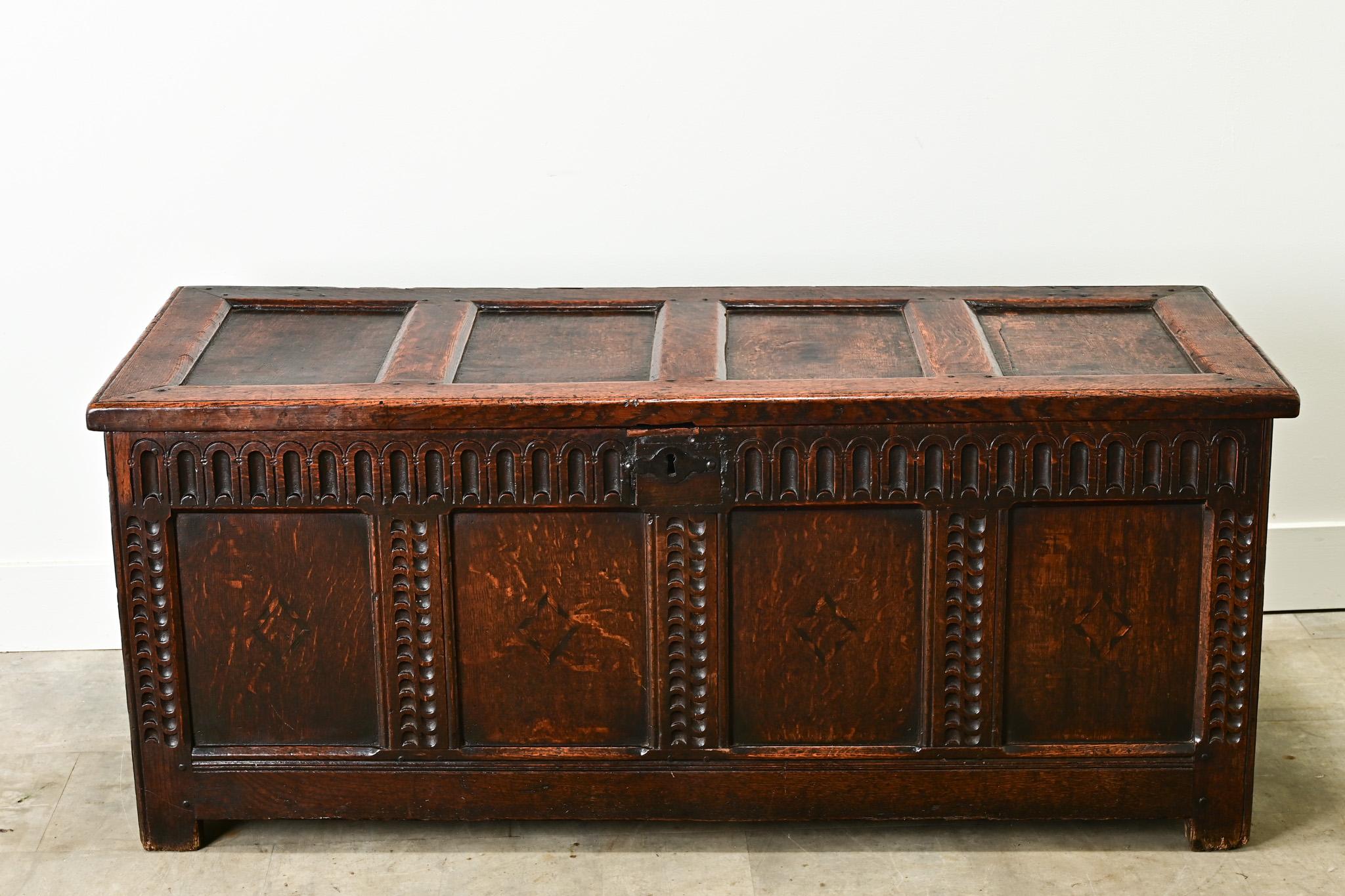 This Dutch solid oak paneled coffer is from the 1800’s. You’ll find carved designs on the exterior with inlay diamond shapes on the front. The sturdy trunk opens on hand forged iron hinges to a wide open interior. Cleaned and polished with a paste