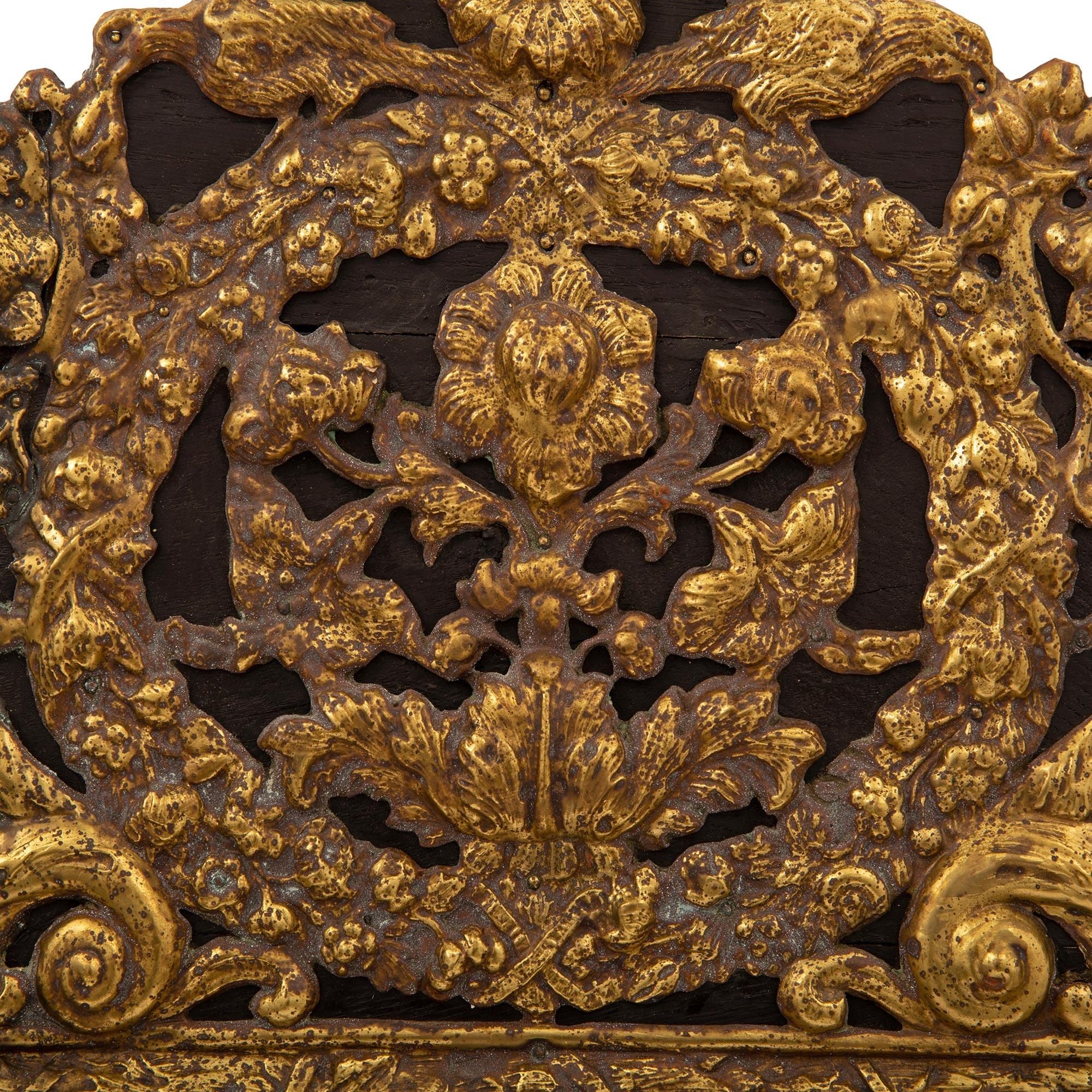Doré Miroir à double encadrement en ébène et métal doré du 19ème siècle en vente