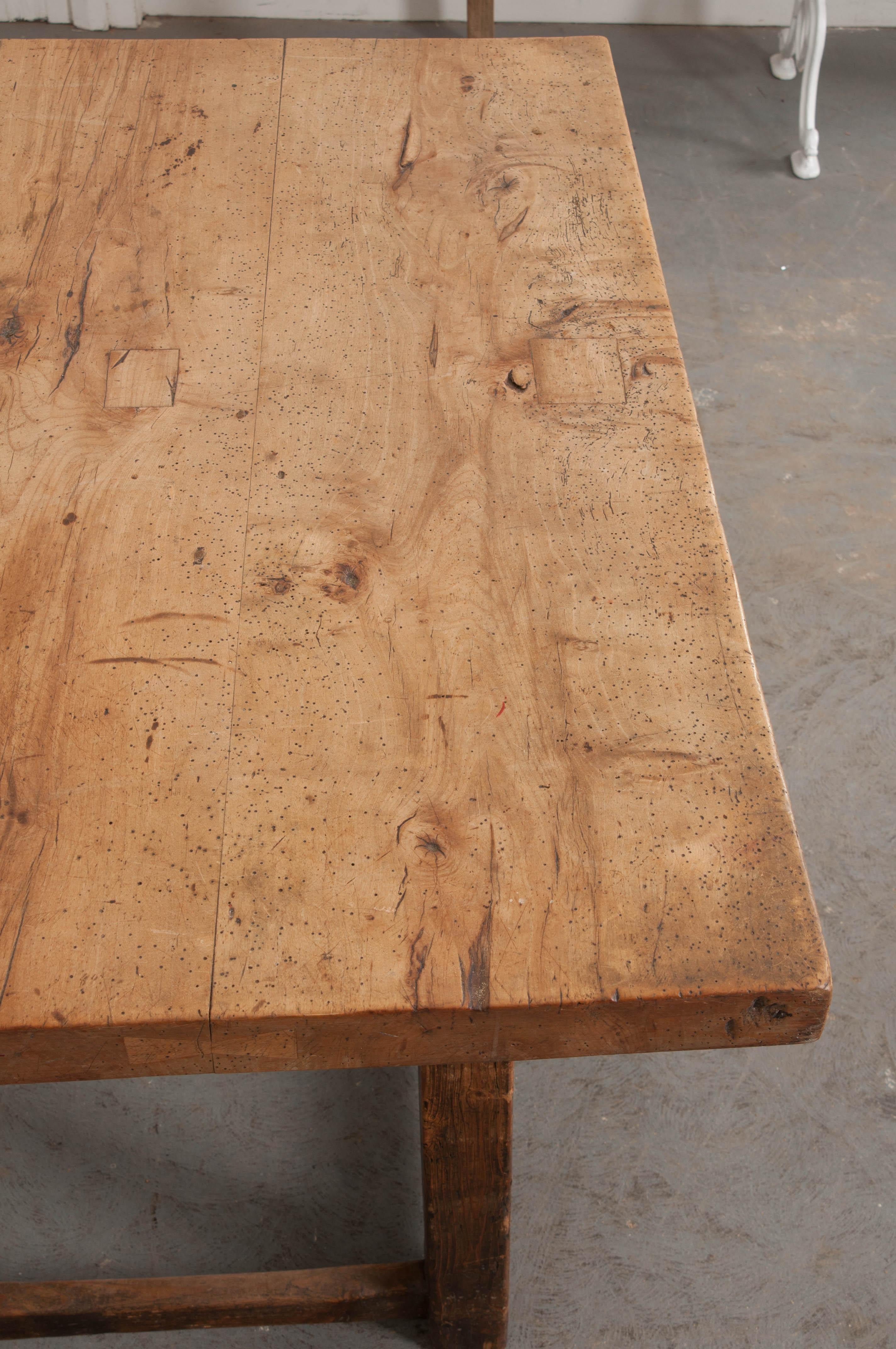 This wonderful mixed woods “Paying Desk”, c.1890’s, is from the Netherlands and typically used by merchants to collect customer payments and as a work space for wrapping up their wares. It features a 2-3/8″ thick wooden surface over an apron with a