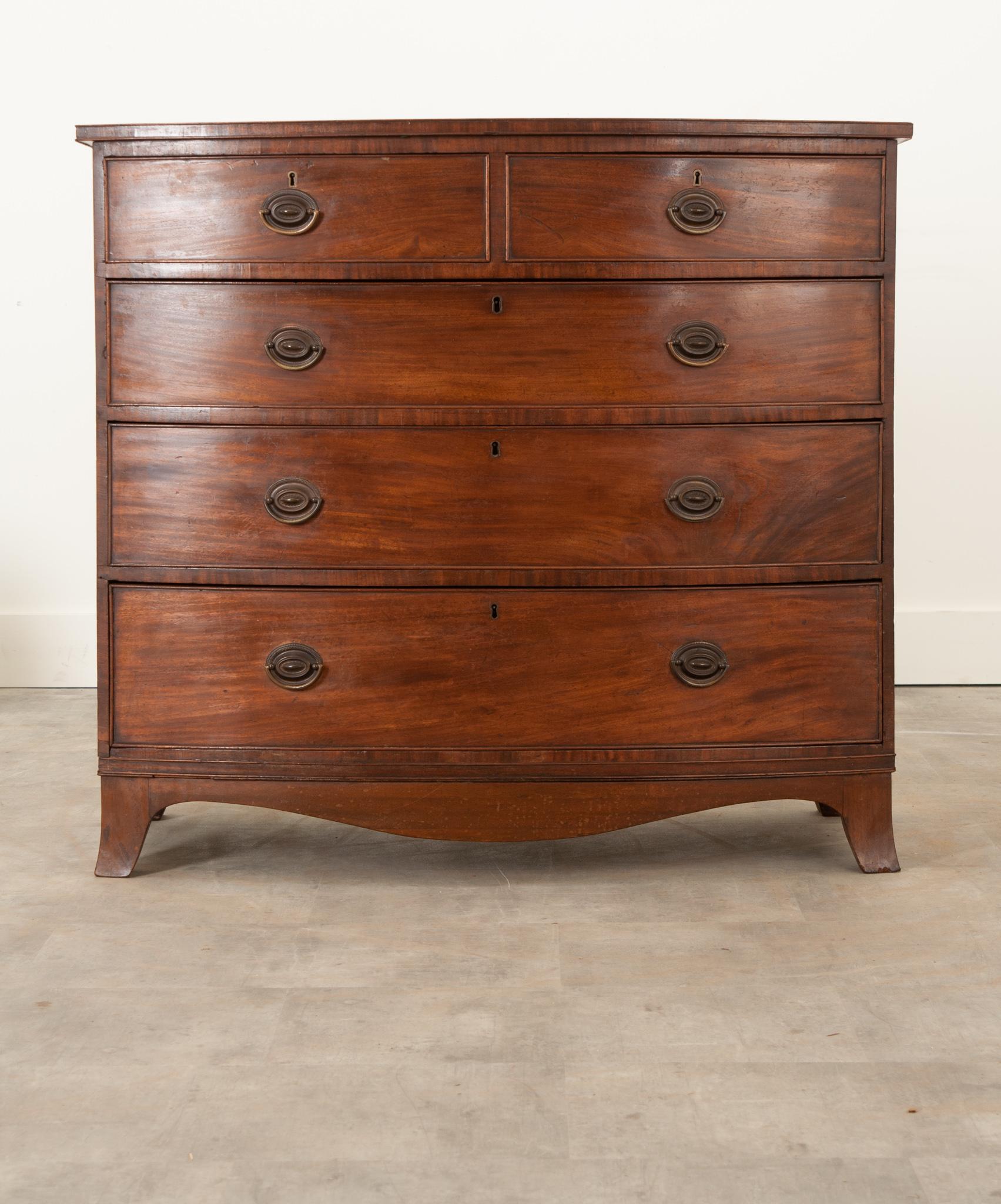 A handsome Dutch chest of drawers from the 19th century. Crafted from oak, it’s gained a fine patina over the years and is in wonderful antique condition. This bow front chest contains five drawers, all of which have been recently cleaned and easily