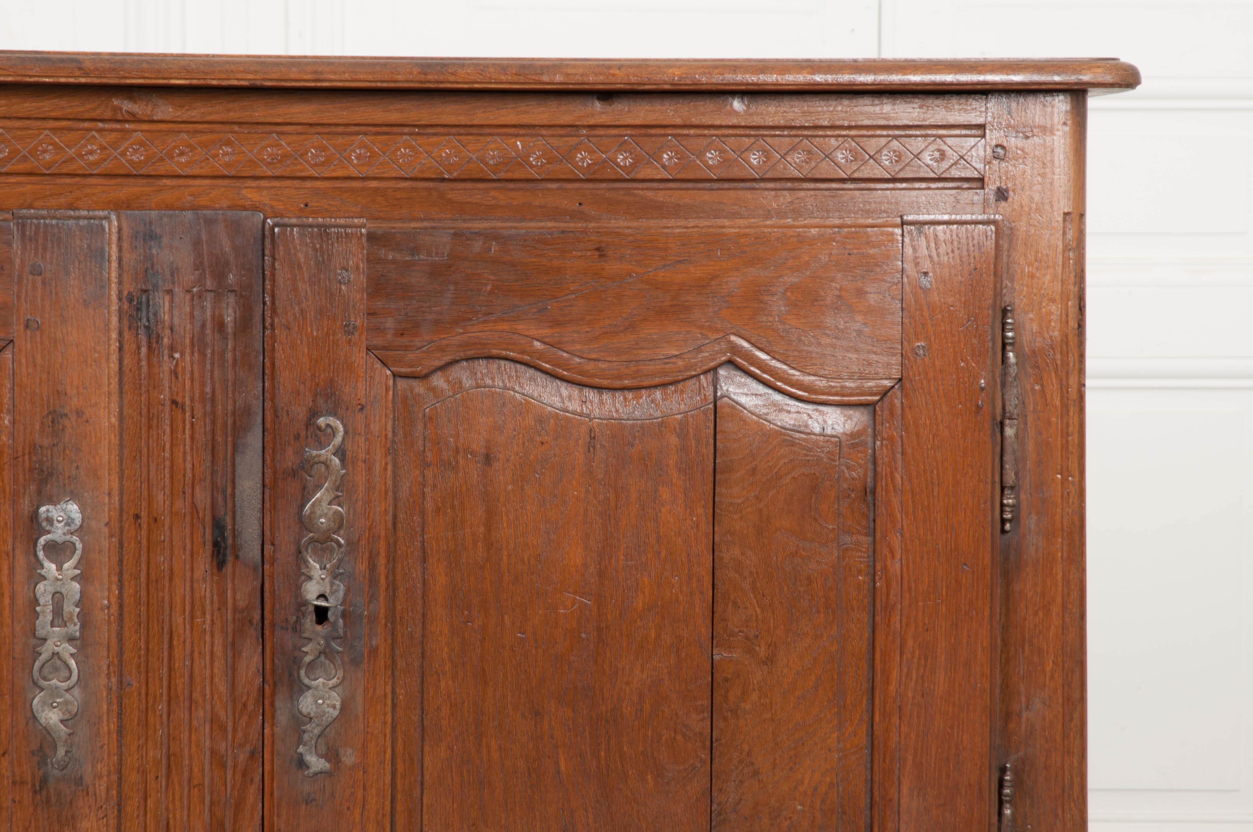 Dutch 19th century Provincial oak buffet a charming, hand carved oak buffet from the latter part of the 19th century. This remarkable Dutch antique features wonderfully carved details. A band of dots-in-diamond motif carving can be found at the