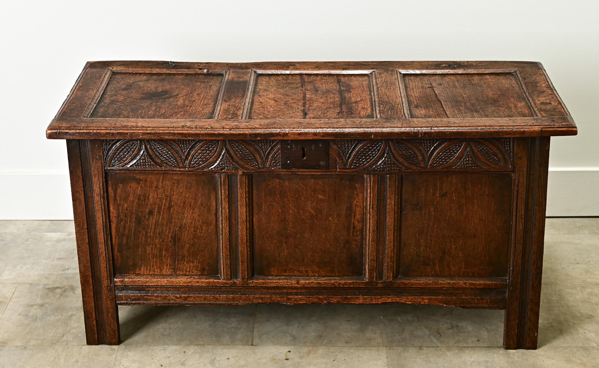 This Dutch solid oak paneled and carved coffer is from the 1800’s. The sturdy trunk opens on hand forged iron hinges to a wide open interior with a candle box in the top right. Cleaned and polished with a paste wax, this antique is ready for your