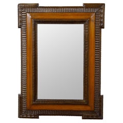 Dutch 19th Century Walnut Mirror with Hand-Carved Décor and Brown Patina
