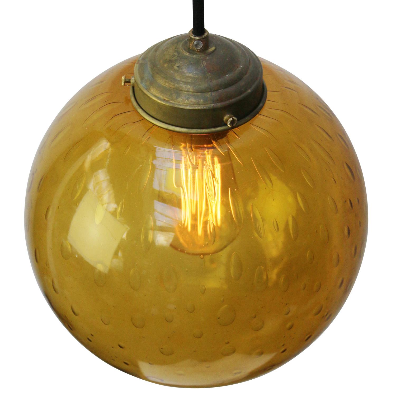 Amber air bubble glass pendant
Brass top
2 meter black flex

Weight: 1.80 kg / 4 lb

Priced per individual item. All lamps have been made suitable by international standards for incandescent light bulbs, energy-efficient and LED bulbs. E26/E27