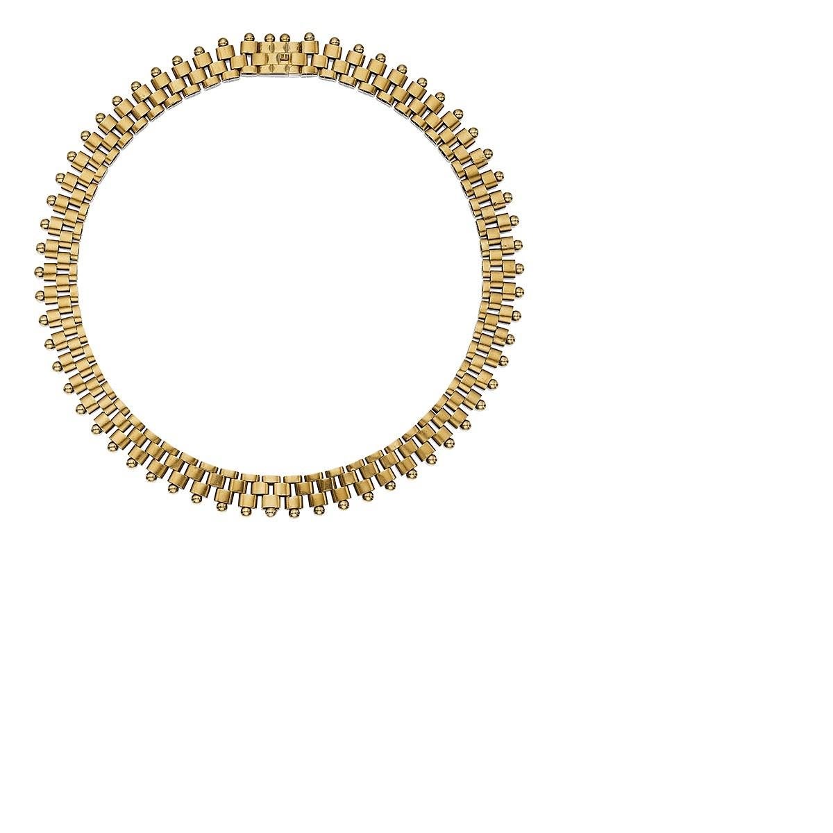 Of Dutch origin, this gold link necklace is composed of three rows of stacked rectangular links with rounded edges and spherical terminals, completed by a brickwork clasp. A retractable bail for hanging a favorite locket or pendant offers extra