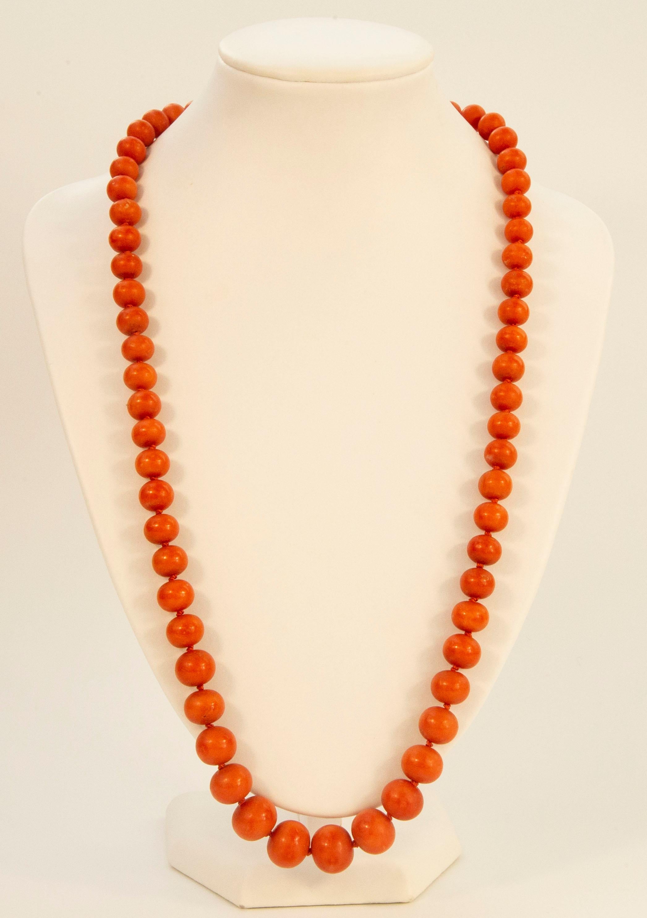 An antique one strand genuine red coral  (Corallium Rubrum*) necklace with a 14 karat yellow gold lock. The beads are graduated and each bead is individually strung on a silk. The necklace was made at the beginning of the 20th century in the