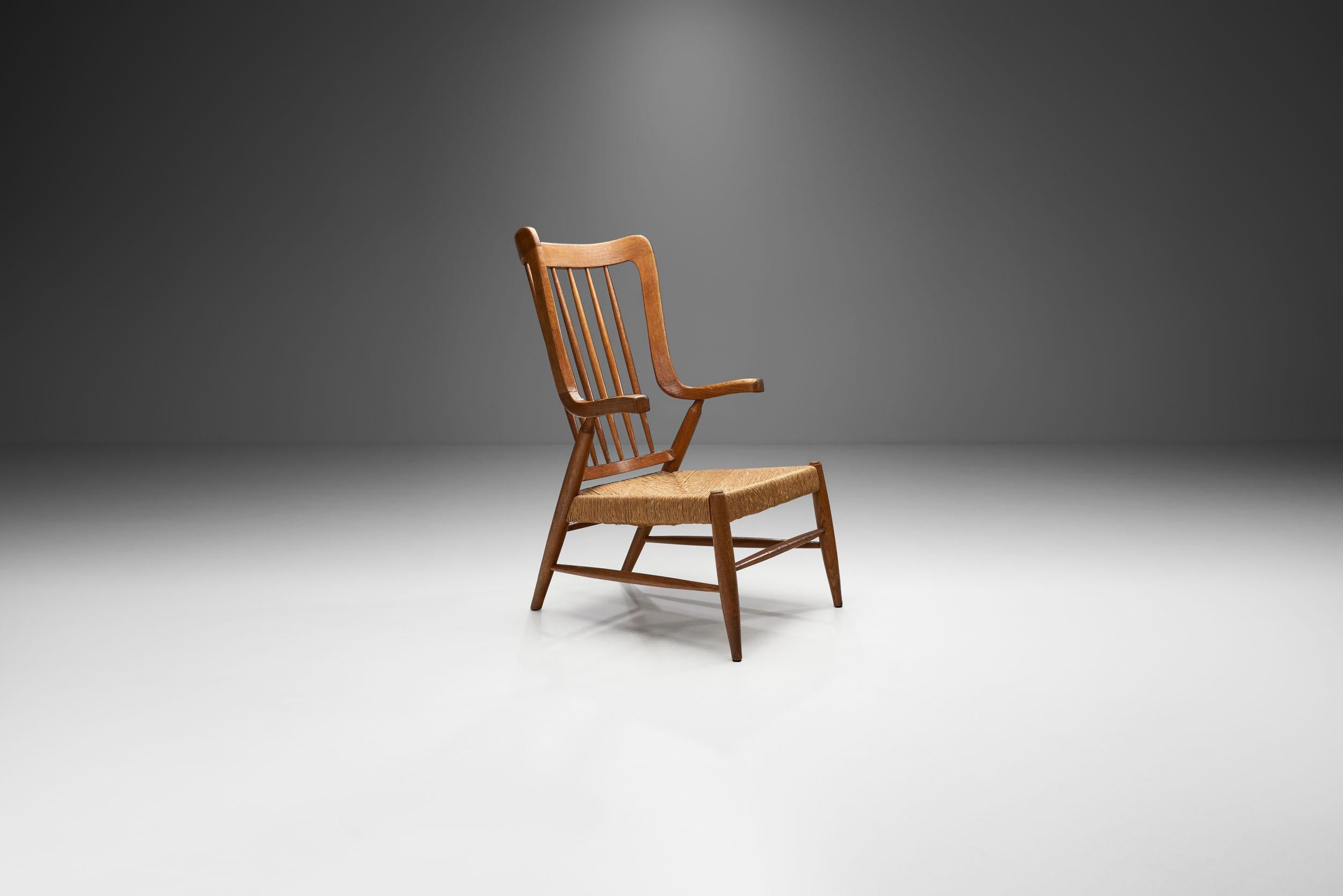 The elements of this chair are very typical of the 1950s’ design of the Netherlands. While the individual design elements are traditional, the quirky shape of the armrests is very unique, and never seen before. Only a rocking chair is known in