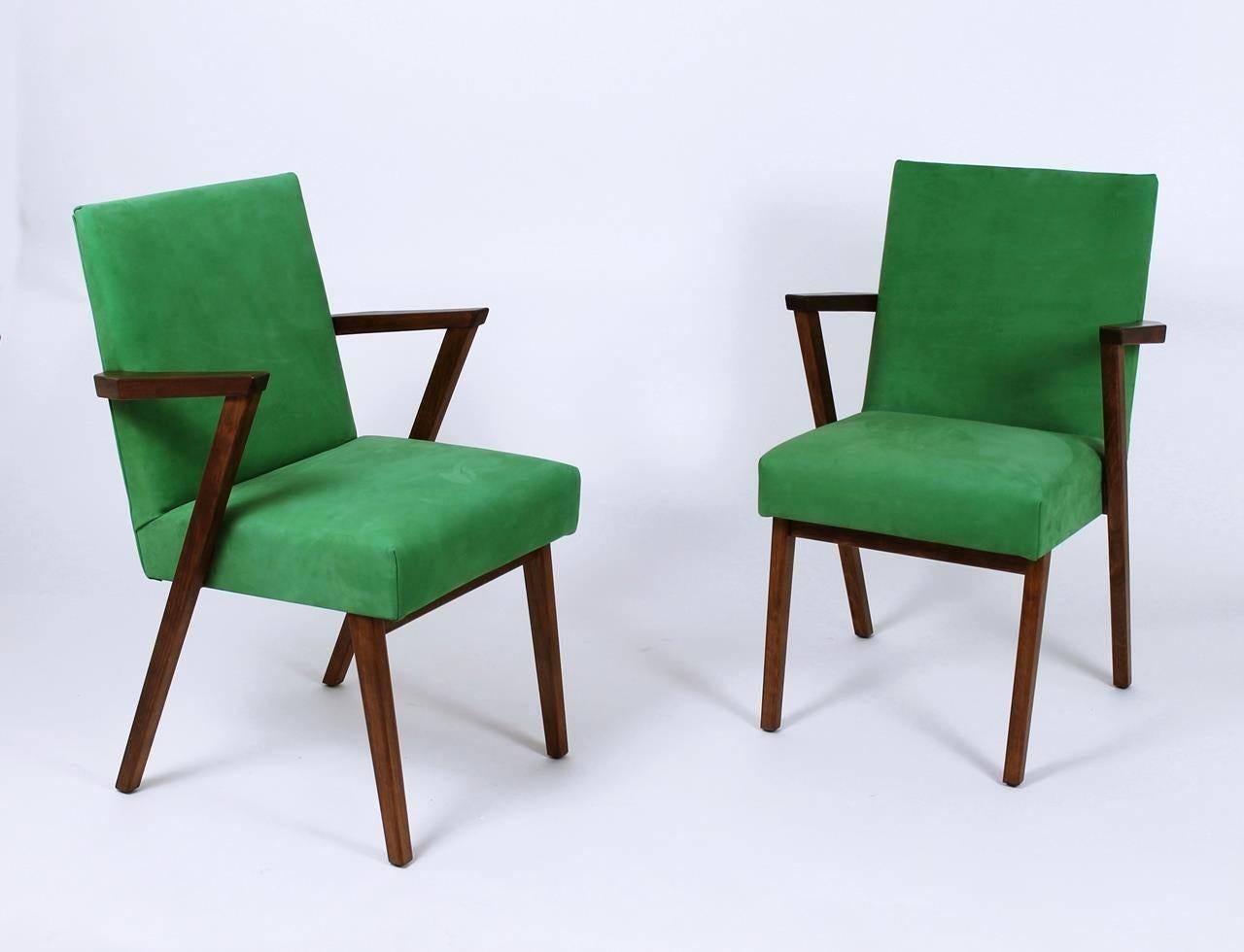 Stunning vintage Mid-Century Modern retro armchair with wedge shaped wood arms by Tijsseling. Newly upholstered in green Italian Nubuck leather.
 