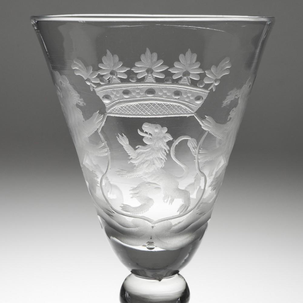 Dutch Armorial Engraved Light Baluster Goblet - County of Holland, c1755

The coat of arms - as with many other such examples - reflects the twists and turns of history; the two lions - each wearing a ducal crown -  on the 'internal' shield are the