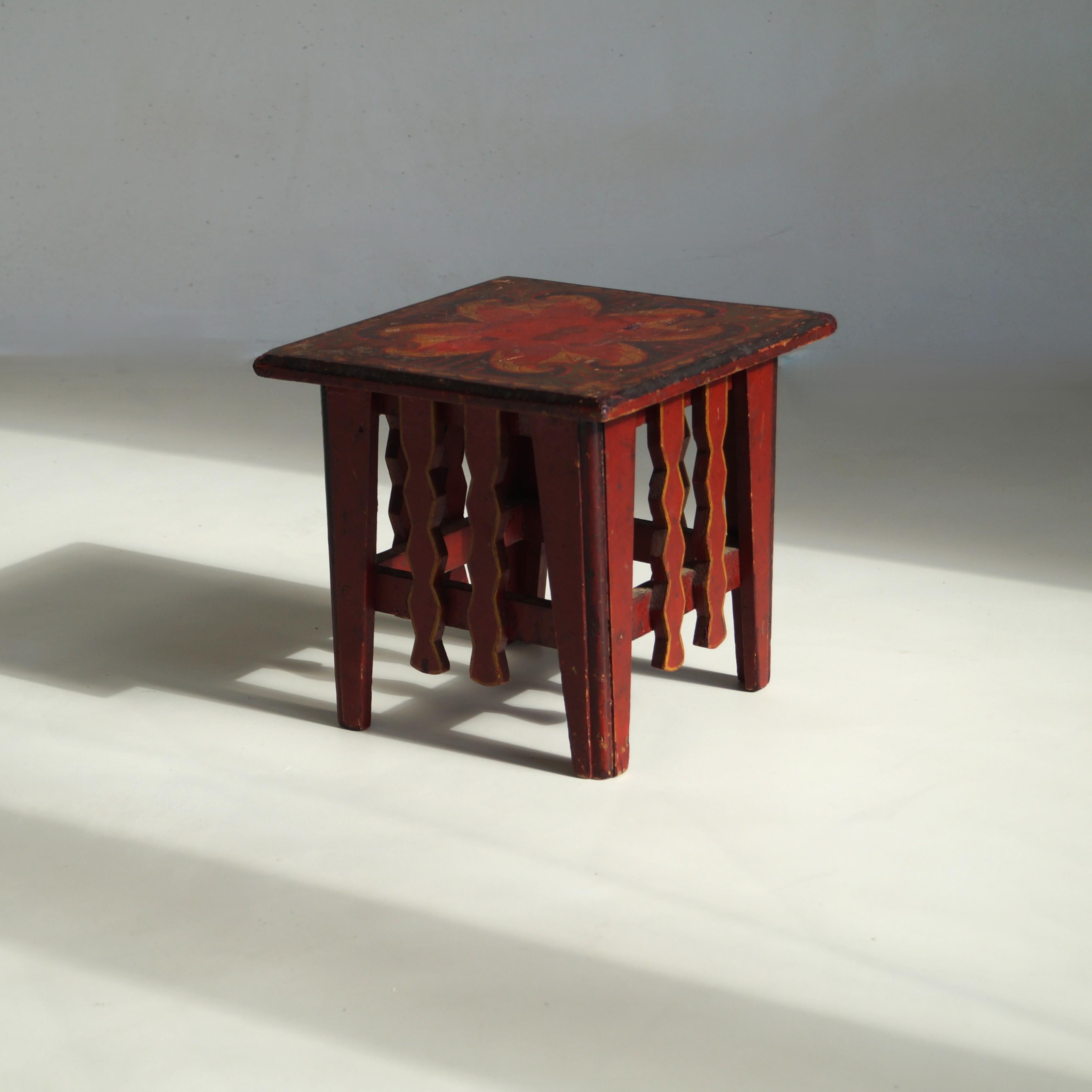 A characterful small pedestal or plantstand,  very recognizably Amsterdamse School period, 1920s. The paintwork has similarities to designs by Jan van Zeeland, a designer from the Dutch Art Deco period who  is known for his hand-painted side tables.