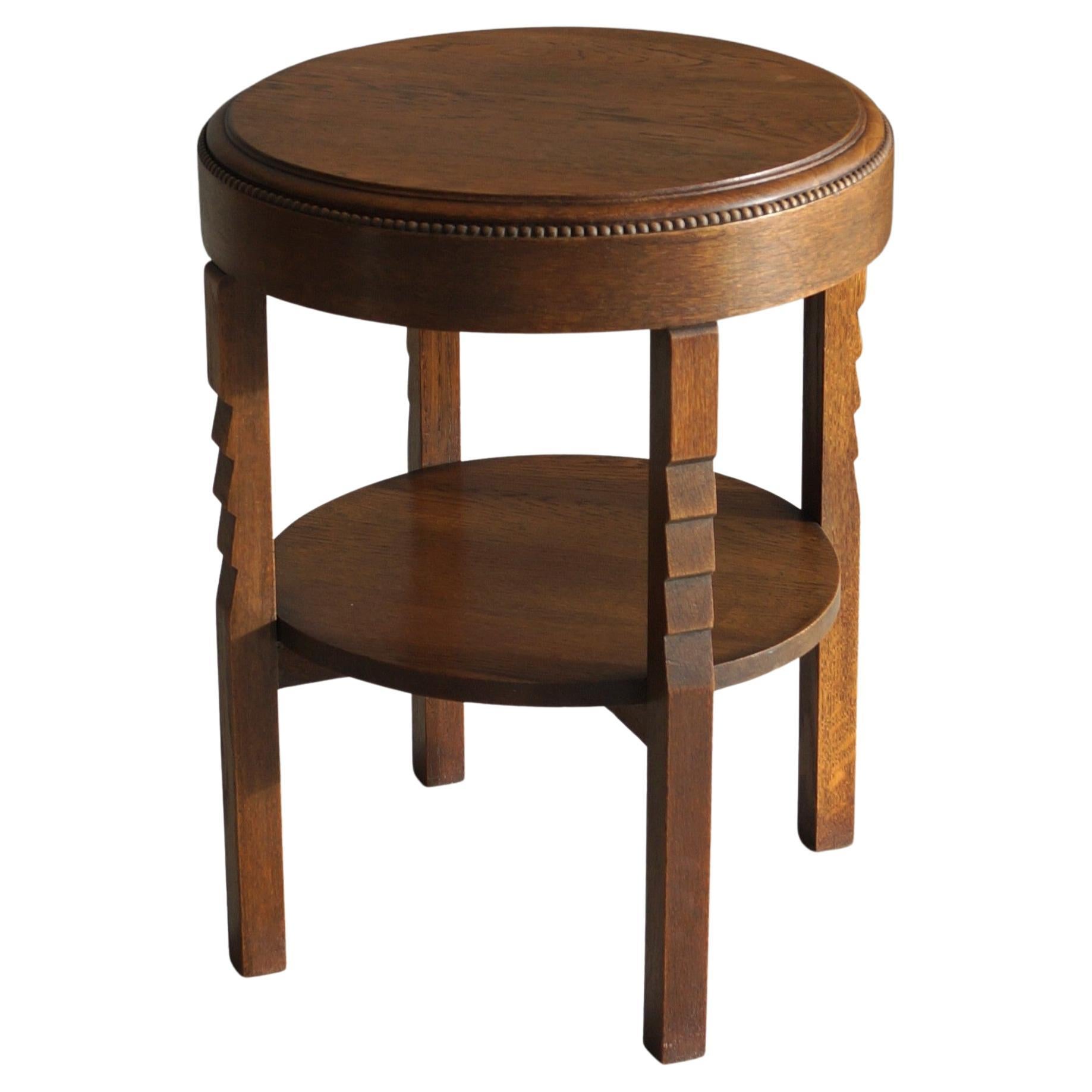 Dutch Art Deco Amsterdam School round side table with sculptural details, 1920s en vente