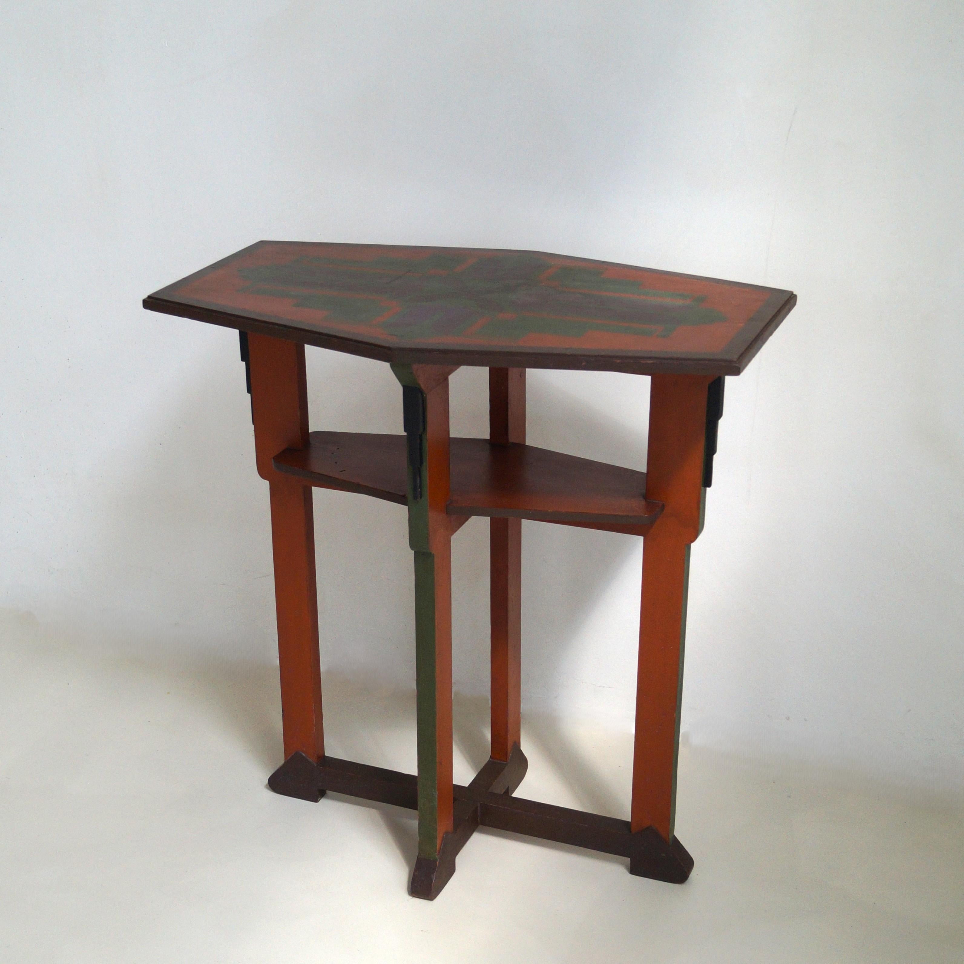 A characterful side table,  very recognizably Amsterdamse School, 1920s - 1930s. The paintwork is attributed to Jan van Zeeland, a designer from the Dutch Art Deco period who is known for hand-painting objects like these.  The table has its original