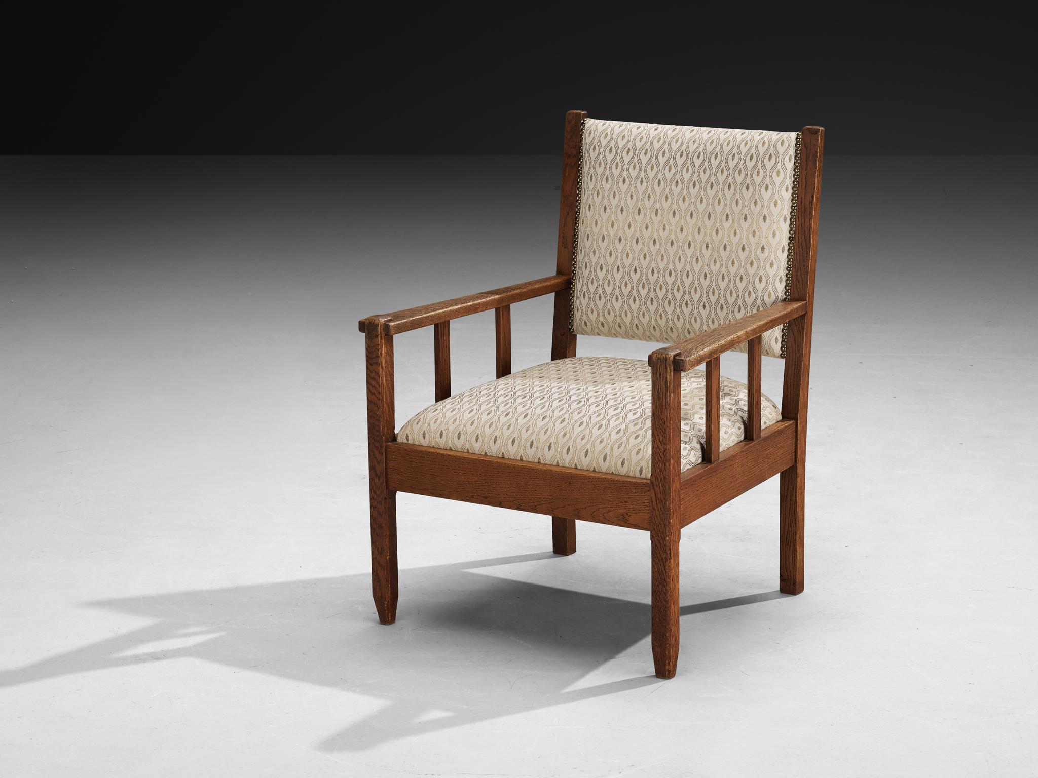 Armchair, LOV Oosterbeek, oak, fabric, Netherlands, 1930s

This armchair exemplifies the timeless craftsmanship of the Dutch furniture manufacturer LOV Oosterbeek. Made from solid oak, the chair radiates simplicity, and a clear purpose. All of the