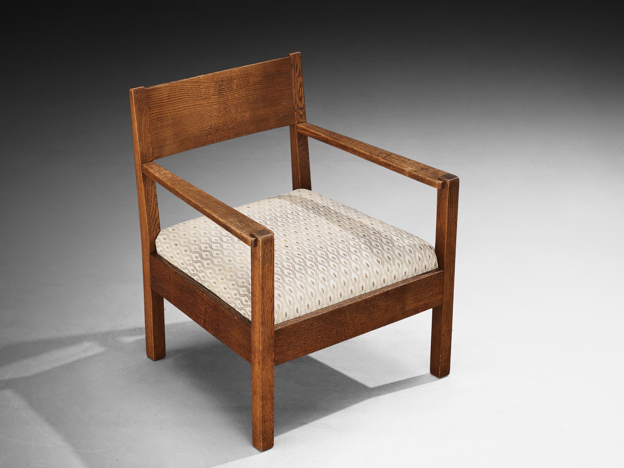 Armchair, LOV Oosterbeek, oak, fabric, Netherlands, 1930s

This armchair exemplifies the timeless craftsmanship of the Dutch furniture manufacturer LOV Oosterbeek. Made from solid oak, the chair radiates simplicity, and a clear purpose. All of the
