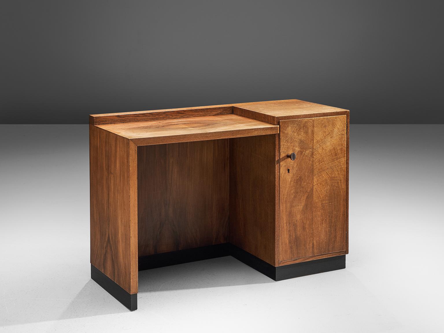 Art Deco Desk, mahogany, The Netherlands, 1930s.

This desk is designed is strong in its design as it features strict lines with a balanced ratio that is known for Dutch Art Deco style. It resembles features of the Amsterdam School by means of the