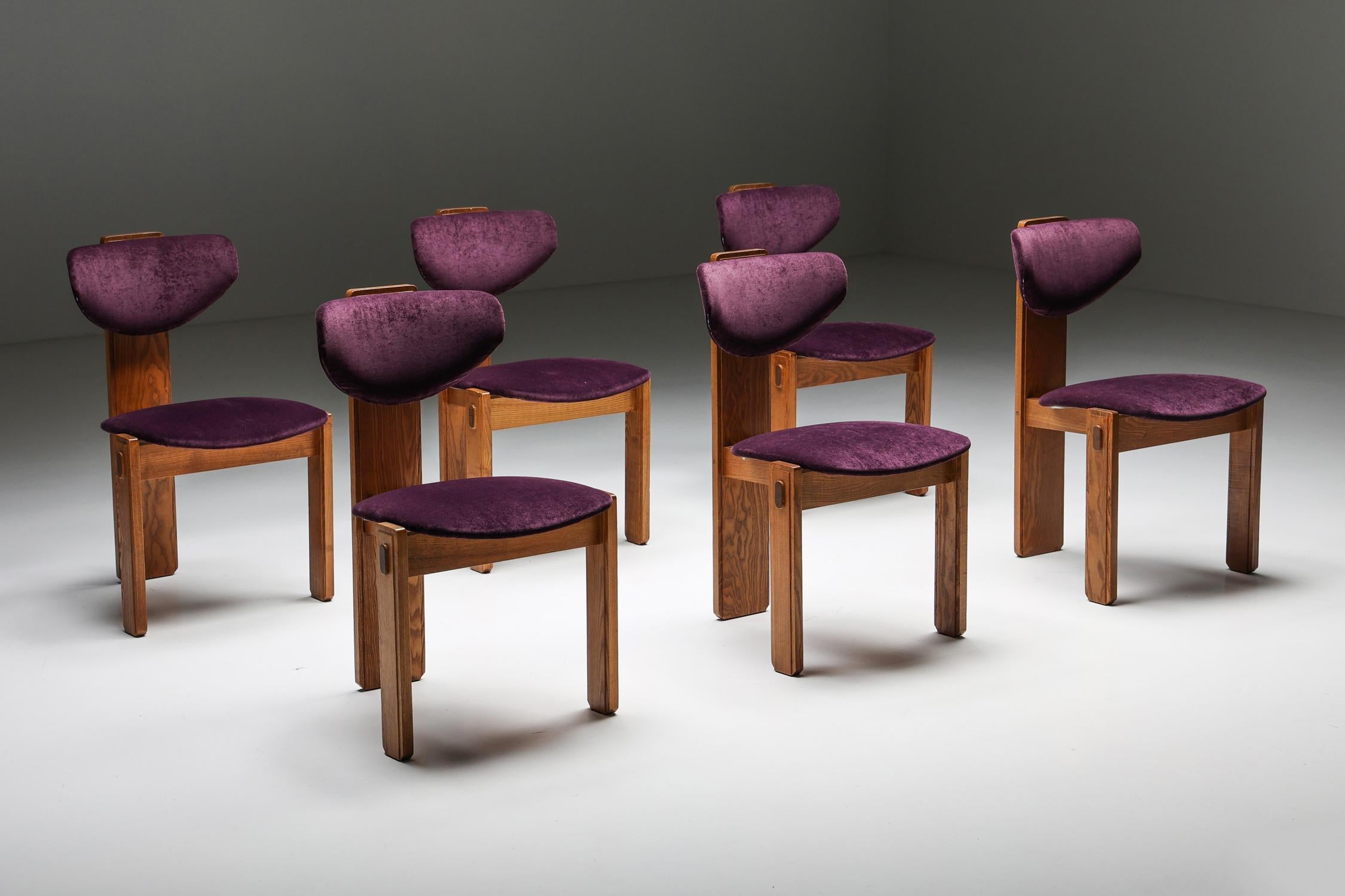 Dutch Art Deco dining chairs purple velvet Amsterdamse School, Early 20th Century

These Dutch Art Deco dining chairs are quite remarkable, resembling the characteristics of the Amsterdamse School these chairs can be dated back to the early 20th