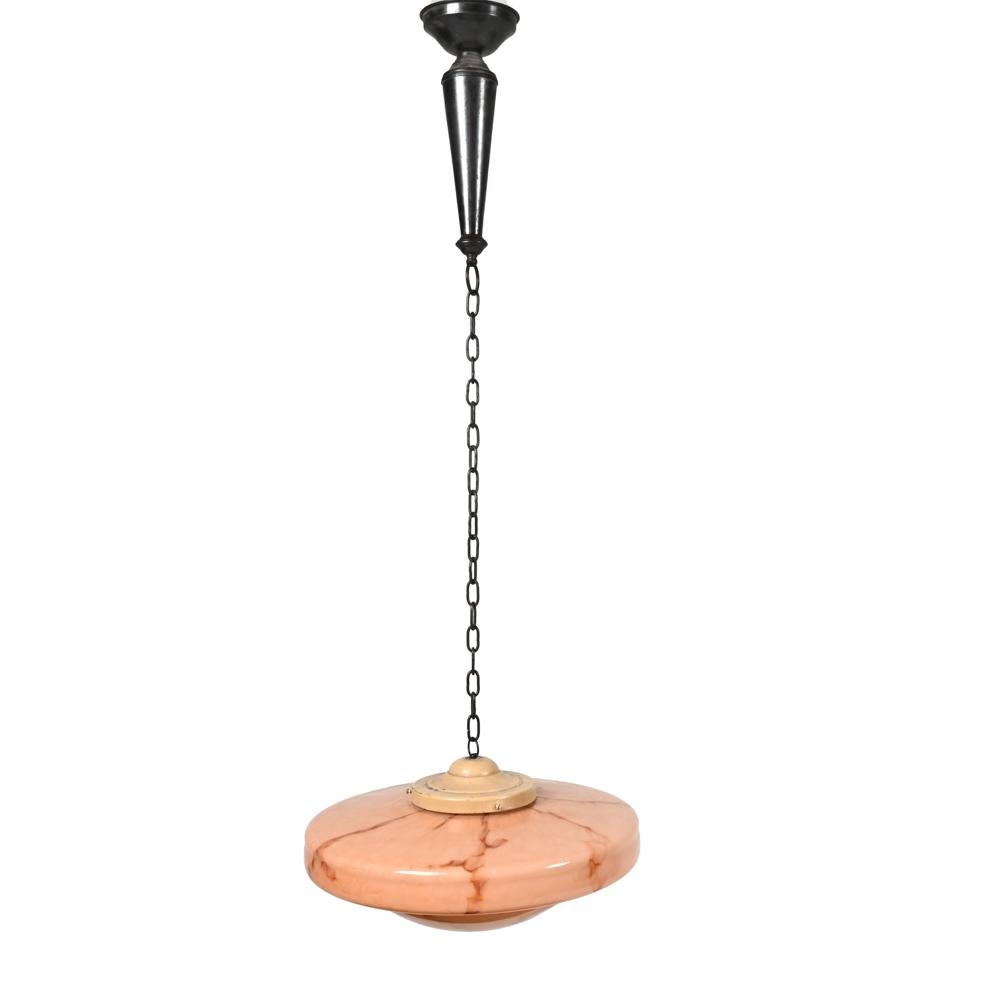 Step into an era where elegance was etched into every detail with this stunning Dutch Art Deco Marbled Pink Glass Pendant Chandelier. Dating back to the 1930s, this masterpiece harks back to a time when design was not just an afterthought but the