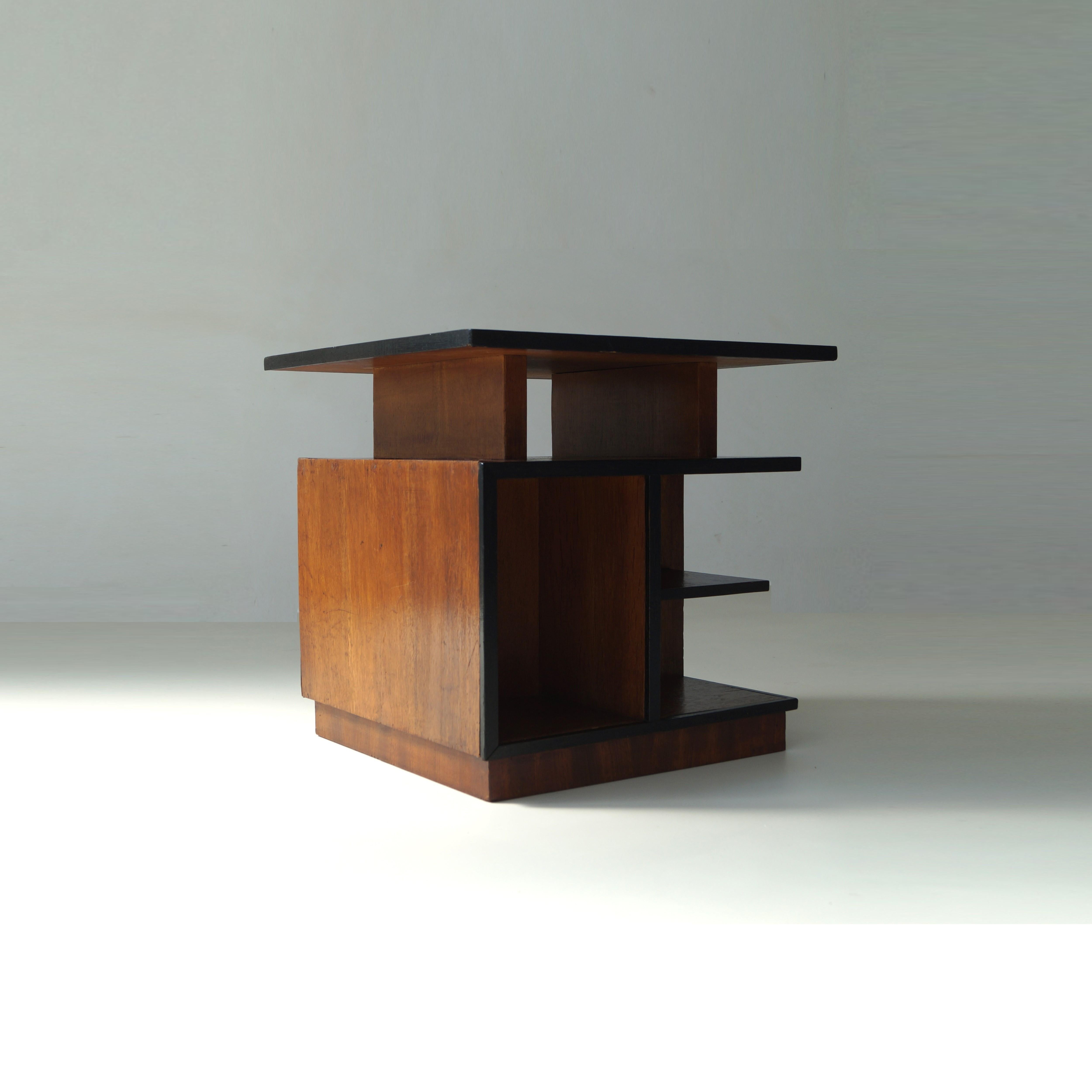 Rare modernist coffee table from the 1920s with an architectural design, which gives the table various appearances depending on the angle it is viewed from. It's a perfect example of Dutch modernism. Material is oak and macassar ebony detail around